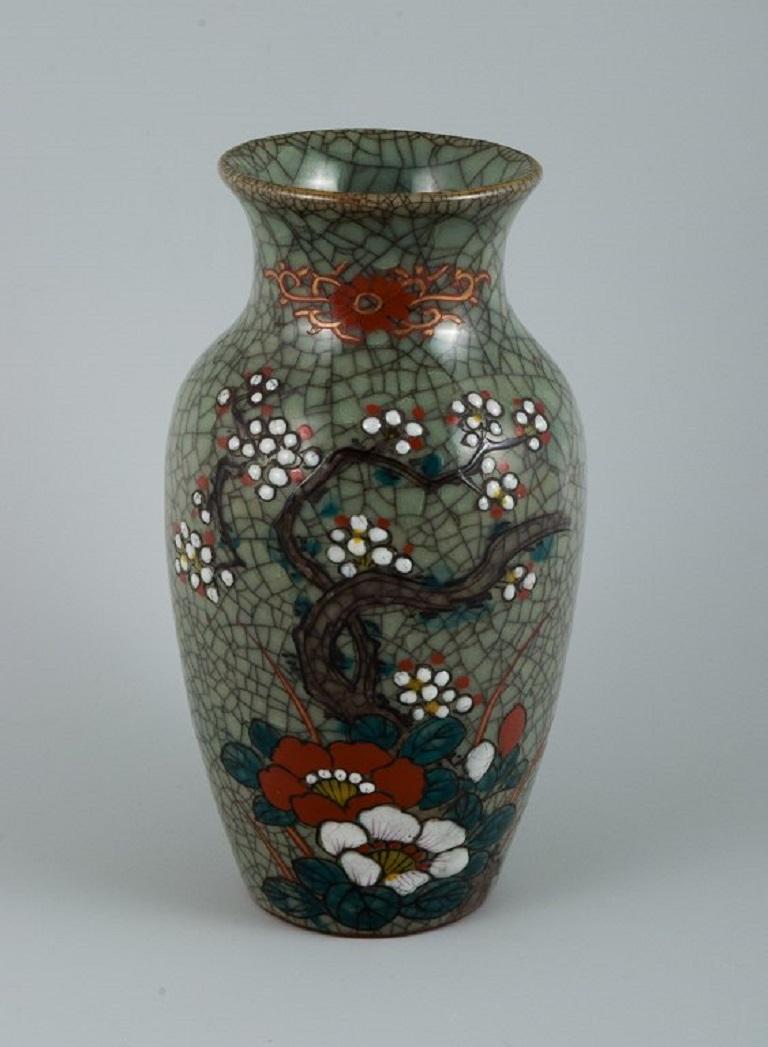 Asian ceramic vase. Hand-painted with a classic floral motif.
In perfect condition.
1900s.
Unmarked.
Measurements: H 18.5 d 10.0 cm.
