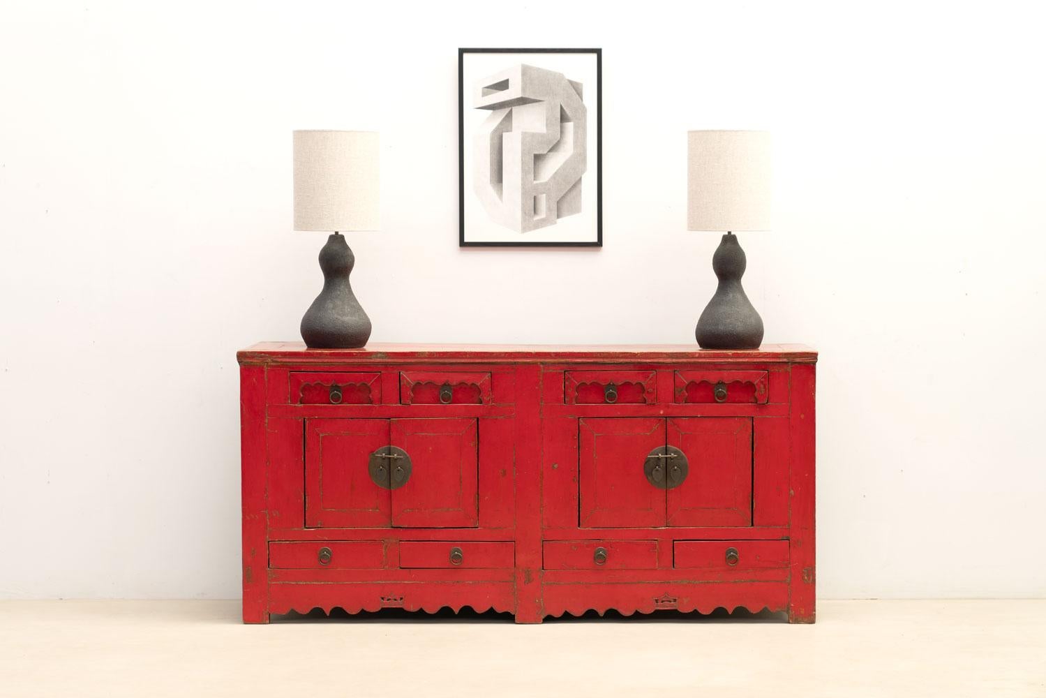  20th-century Asian decorative chest of drawers crafted from wood, adorned with a stunning red patina that adds warmth and character to any space.

Please do not hesitate to contact us for any additional information. We would be more than delighted