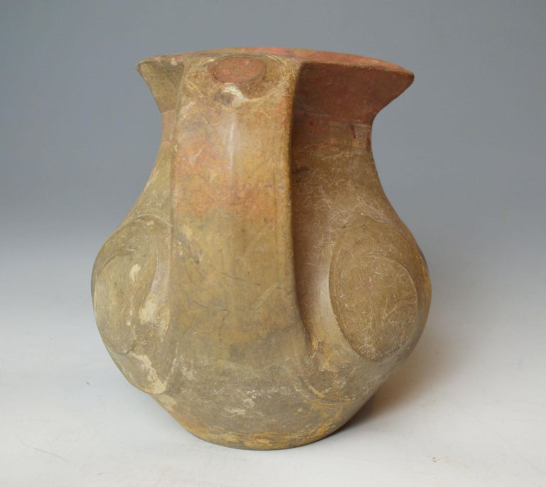A fine antique Chinese terracotta amphora vase with twin broad strapped
handles. The circular body decorated with scrolls.
Provenance: UK collection Cambridge before 1960
Ming dynasty and earlier 1368 - 1644 CE
Dimensions: H 18 x W 20 x D 15