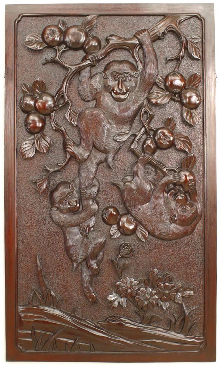Asian Chinese style (19th century) carved wall plaque with monkeys playing in trees with fruit (finished on back with bamboo trees).
 
