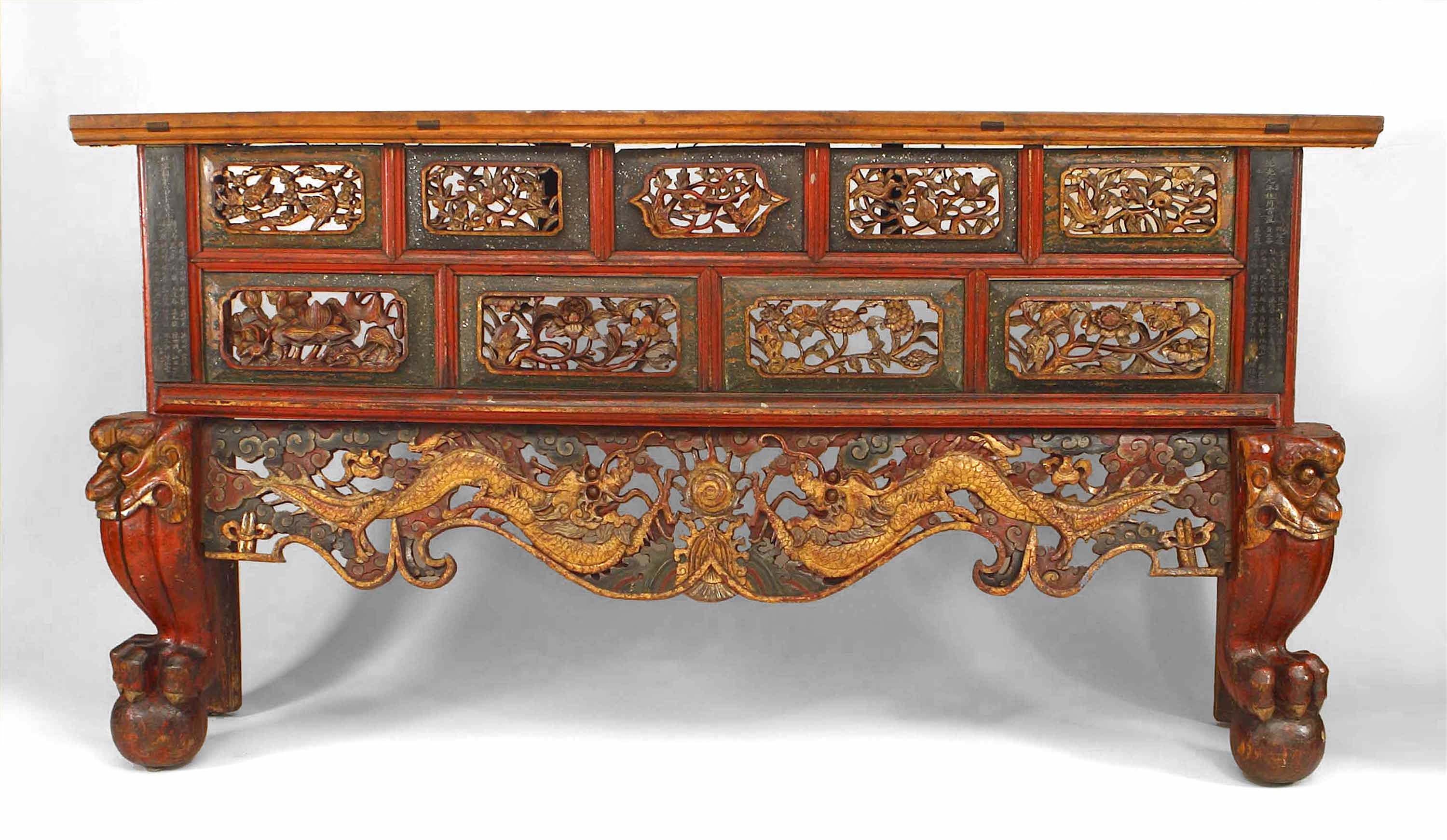 Asian Chinese style (19th century) large red and gold lacquered narrow console table with filigree carved panels and brown marble-top.
 