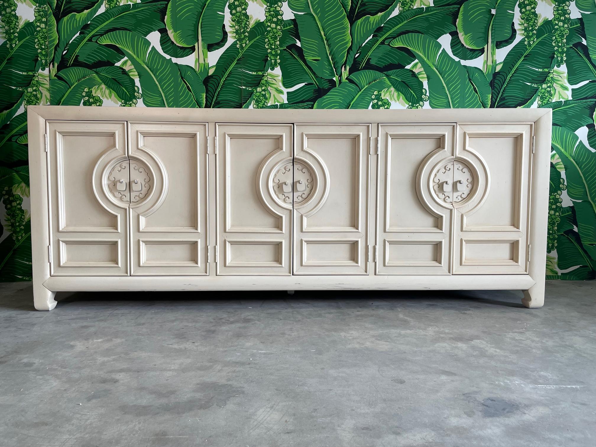 Heavy credenza by Century Furniture features Asian style hardware and Ming Feet. Has been painted by previous owner. Good condition with imperfections consistent with age. May exhibit scuffs, marks, or wear, see photos for details.

 