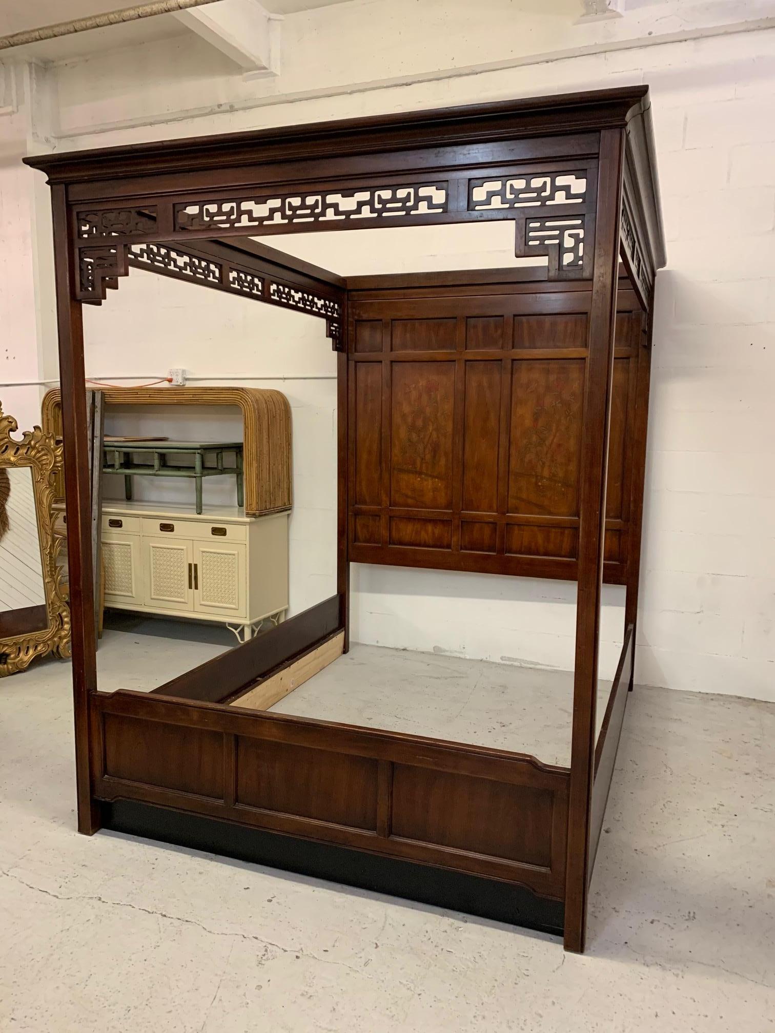 Queen size poster bed by Bernhardt in Asian chinoiserie style features hand carved inlayed headboard and fine cut detailing along top rails. Good condition with minor imperfections consistent with age.