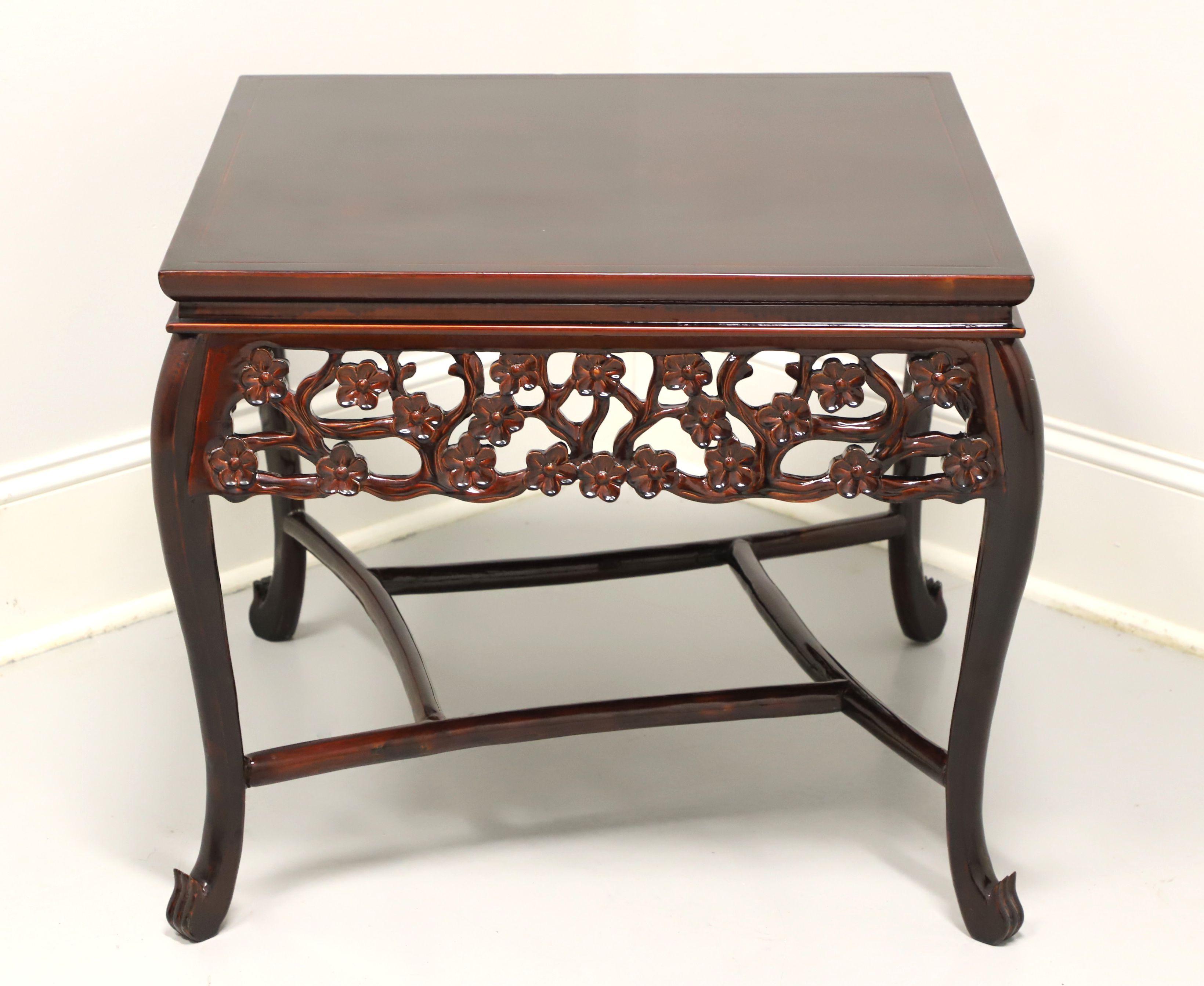 An Asian Chinoiserie style square accent table, unbranded. Solid rosewood, banded top, open carved foliate design to apron, curved legs, connected squared design stretchers and turned up fluted feet. Features the banded top and decoratively carved