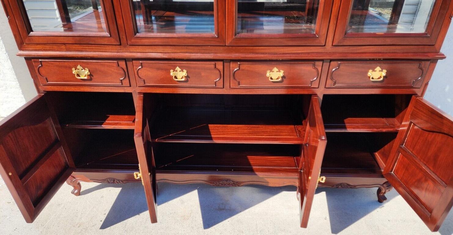 For FULL item description click on CONTINUE READING at the bottom of this page.

Offering one of our recent palm beach estate Fine furniture acquisitions of a
vintage asian chinoiserie solid rosewood china cabinet 
Featuring 3 adjustable