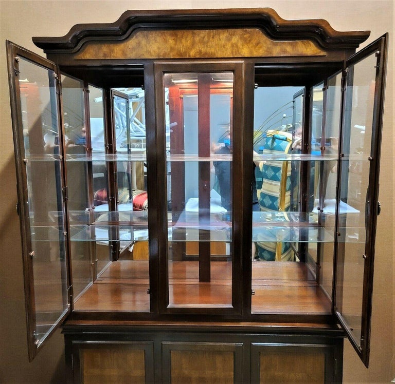 Universal Furniture Asian Pagoda Chippendale Style Chinoiserie China Display Cabinet (2 Piece)

Featuring inside lighting, 3 glass shelves, and solid Mahogany with inlaid Ash Burl panels.

Approximate Measurements in Inches
85