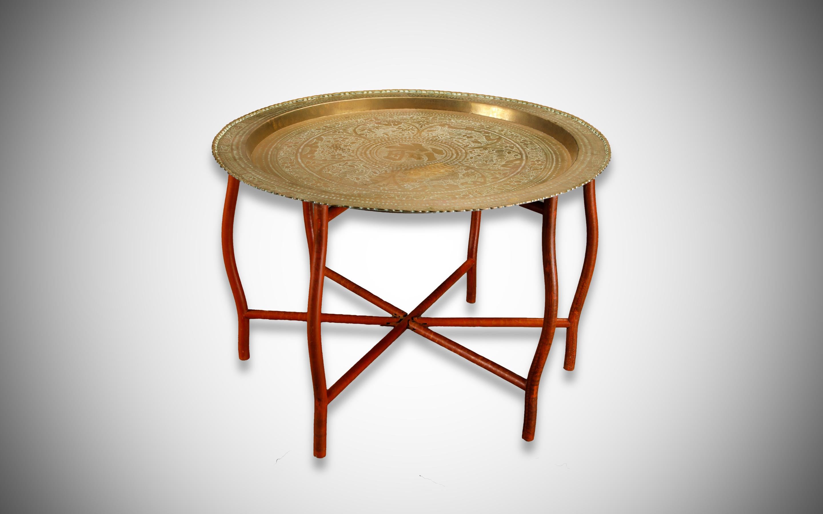 This beautiful Asian tray table features engraved and hammered brass over a foldable wood base. Works great as a coffee / cocktail table, tea table, portable tray for serving (aka serving table), relocatable table for Zoom meetings, and more.