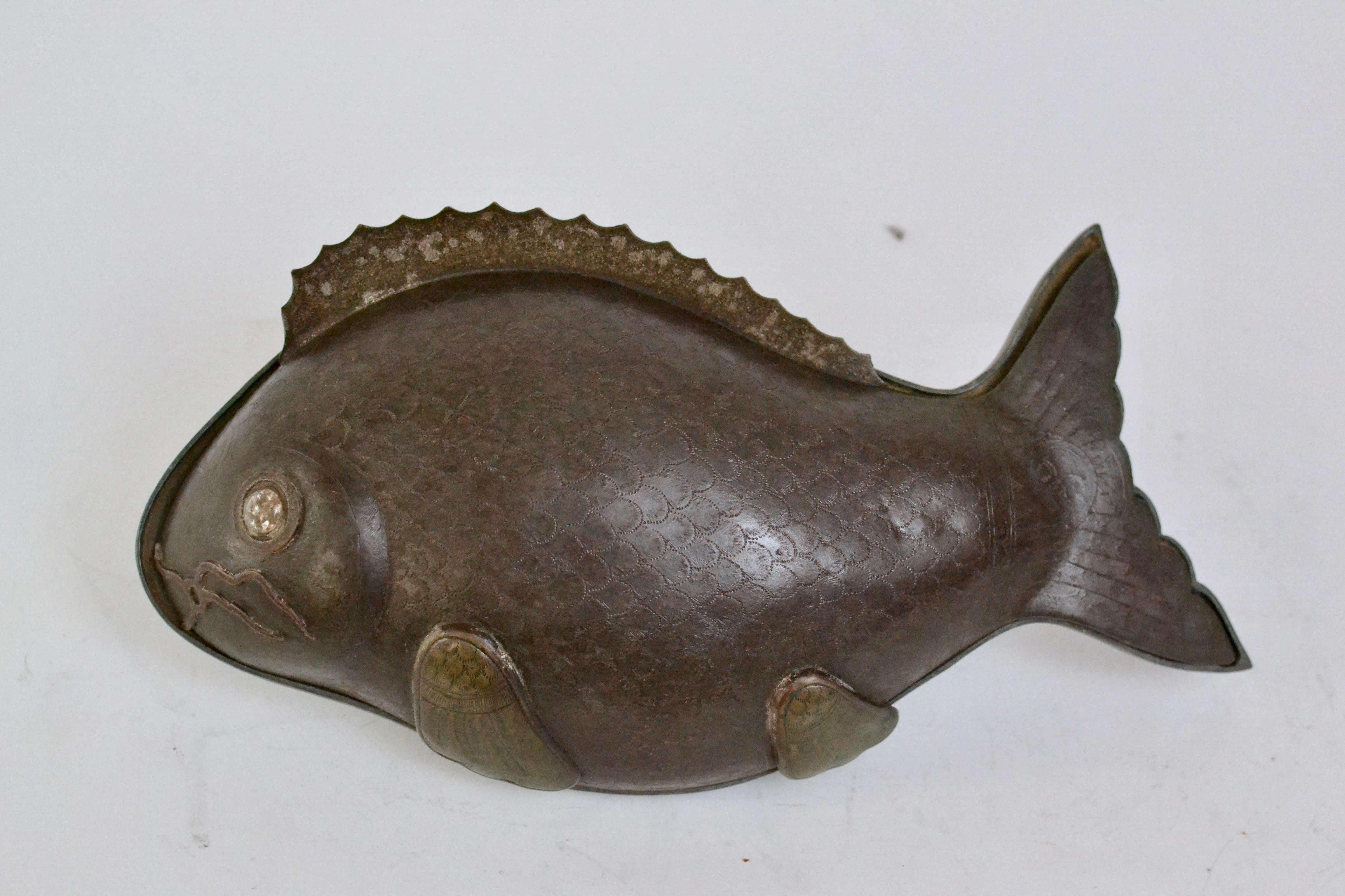 An Asian fish-shaped metal box or tureen, 19th century or early 20th century.