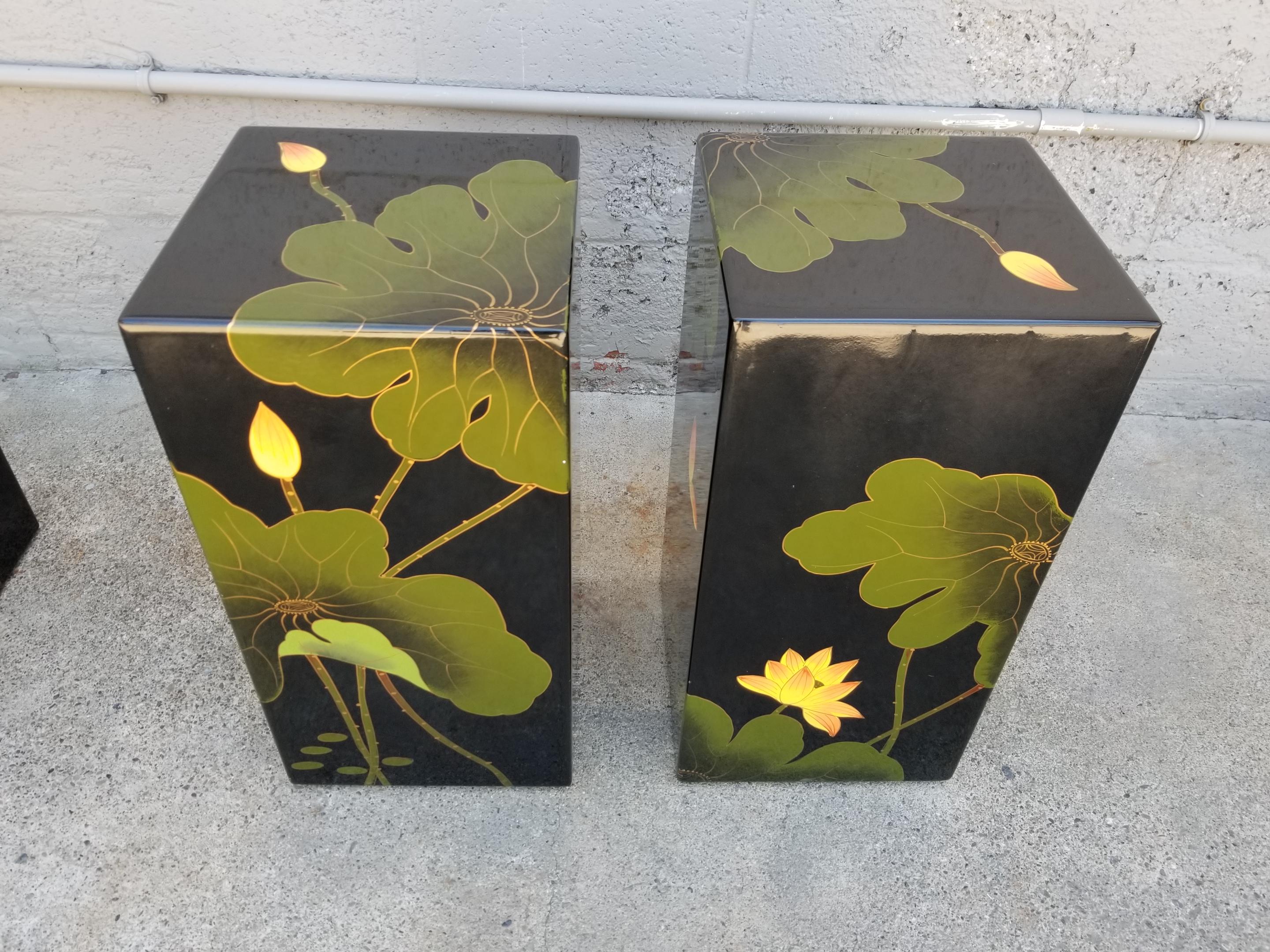 A pair of Asian lacquered stools or pedestals with lily pad motif. Bold color palette with black, green and yellow. Please check our postings for accompanying console table.