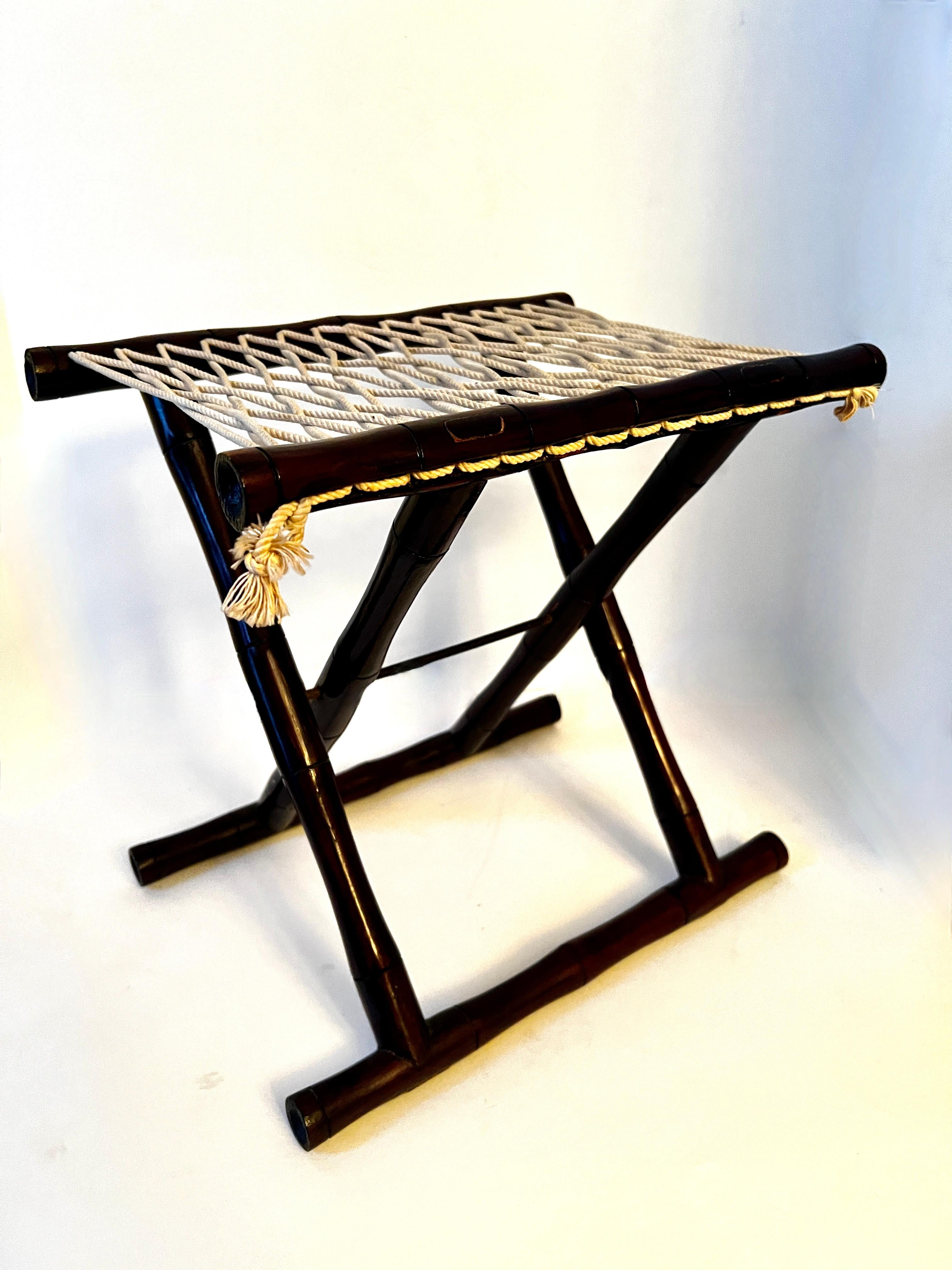 Folding Asian Fishermans Stool with Bamboo Frame and Woven Rope seat.  A wonderful decorative piece - this can also be practical, however, due to the size will likely work best under a console or other side table.  

We also like to use these with
