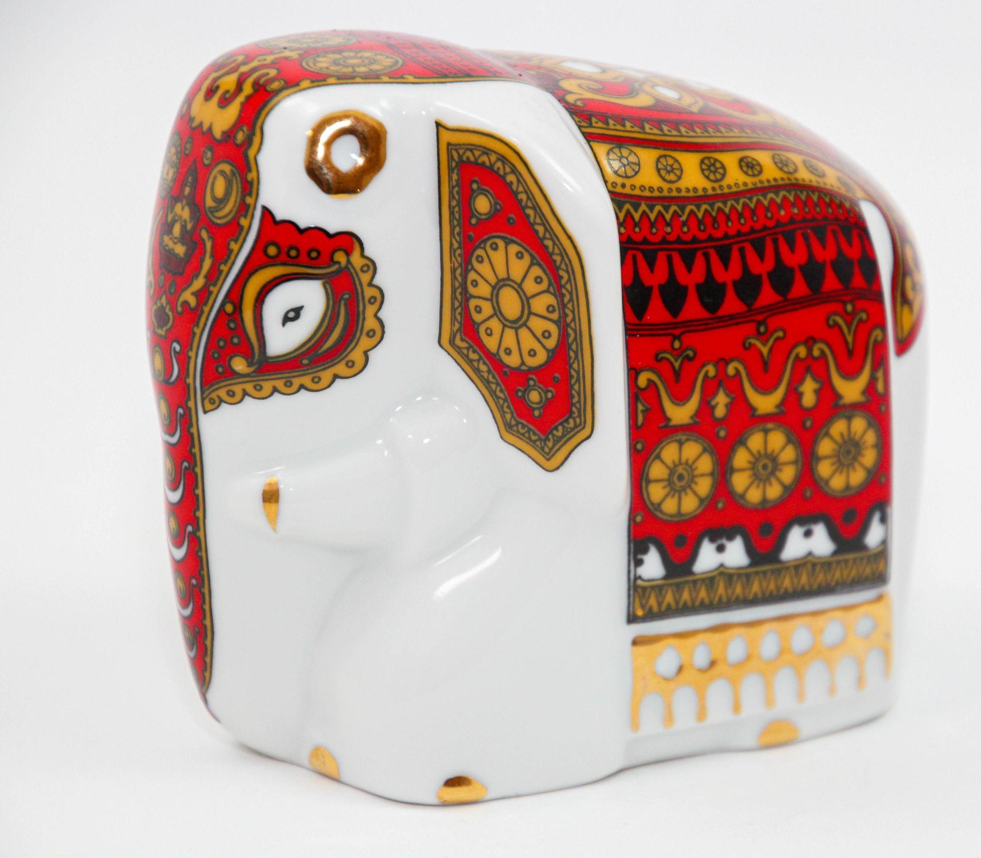 Asian Gilded Porcelain Elephant Ornament Paperweight from Sri Lanka.
Charming Mlesna porcelain with gold and red on white.
This porcelain elephant with exquisite gold gilding was manufactured by Lanka Porcelain pvt LTD in Sri Lanka.
It was