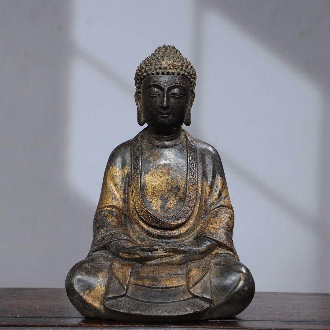 This solemn Asian Gilt Bronze Sitting Buddha Statue with Gesture of Both Hands on Legs is nice and collectible.

The Buddha seated in the meditation posture is known as the Dhyana Mudra or Samadhi Mudra. This gesture symbolizes meditation,