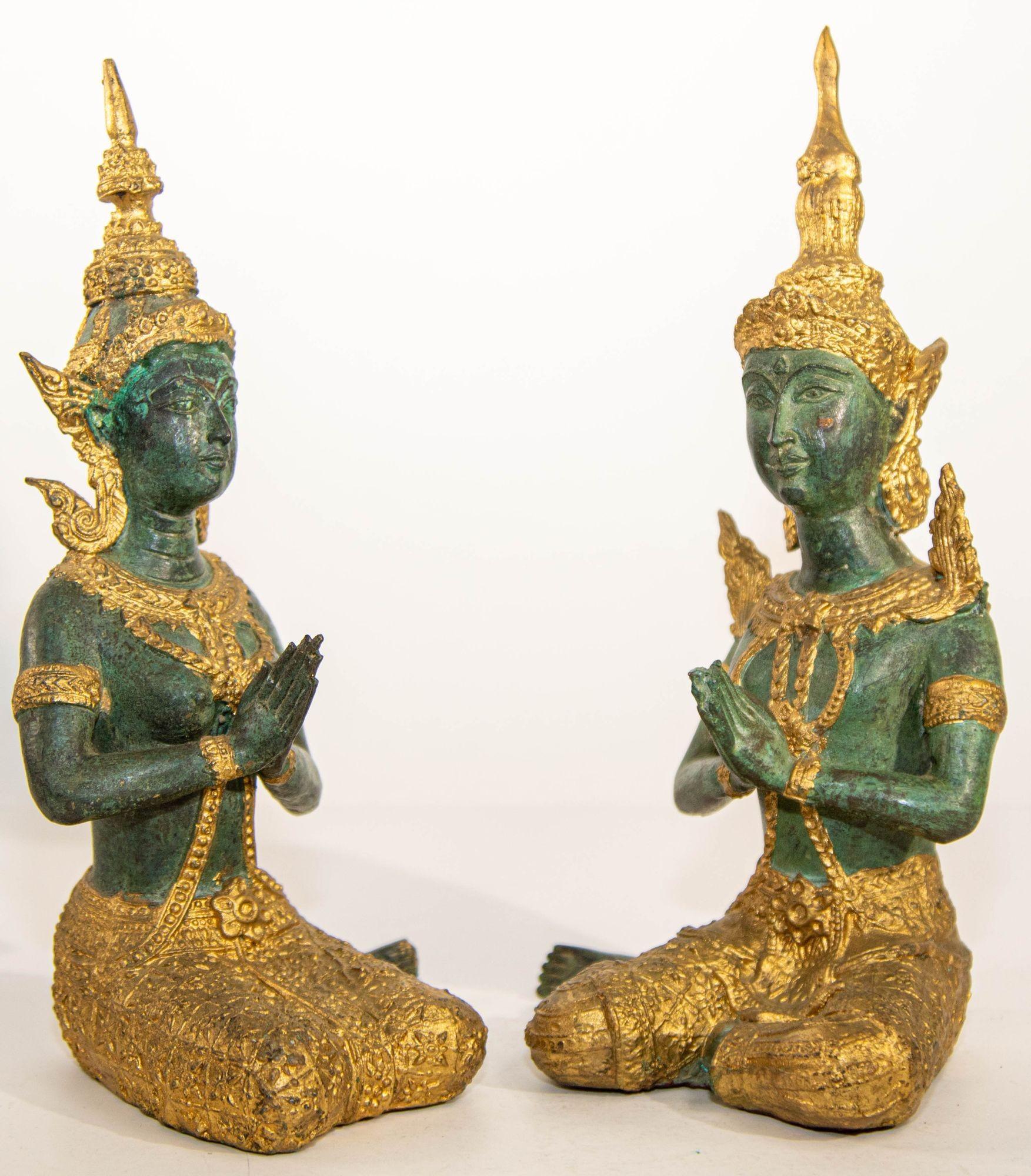 Two Asian gilt bronze Teppanom kneeling Thai sacred angels.
Bronze gilded temple guardians in a sitting position. These temple guardians were made in Thailand.
Gilt Kneeling Thai Buddhist gatekeeper male and female angels kneeling