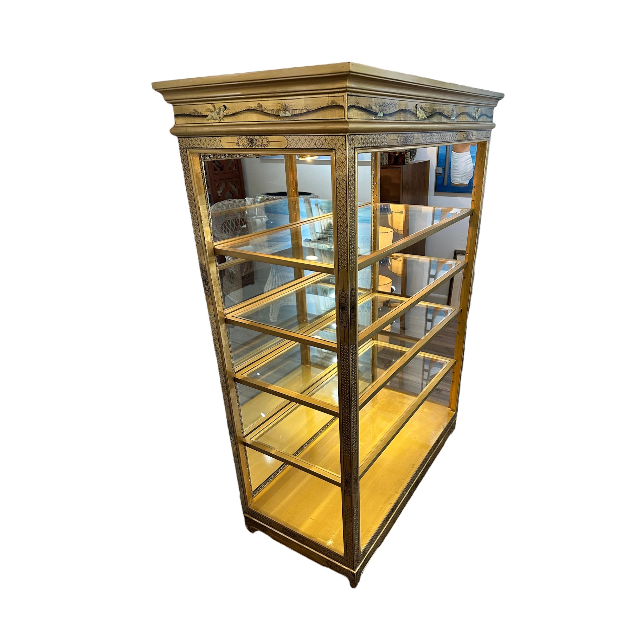 This is a beautiful curio cabinet. I have been using this as a display unit in my Consignment Gallery. What I love about it is it open on all sides so you could see feel and touch the objects and it has a mirrored back, the glass shelves are in good