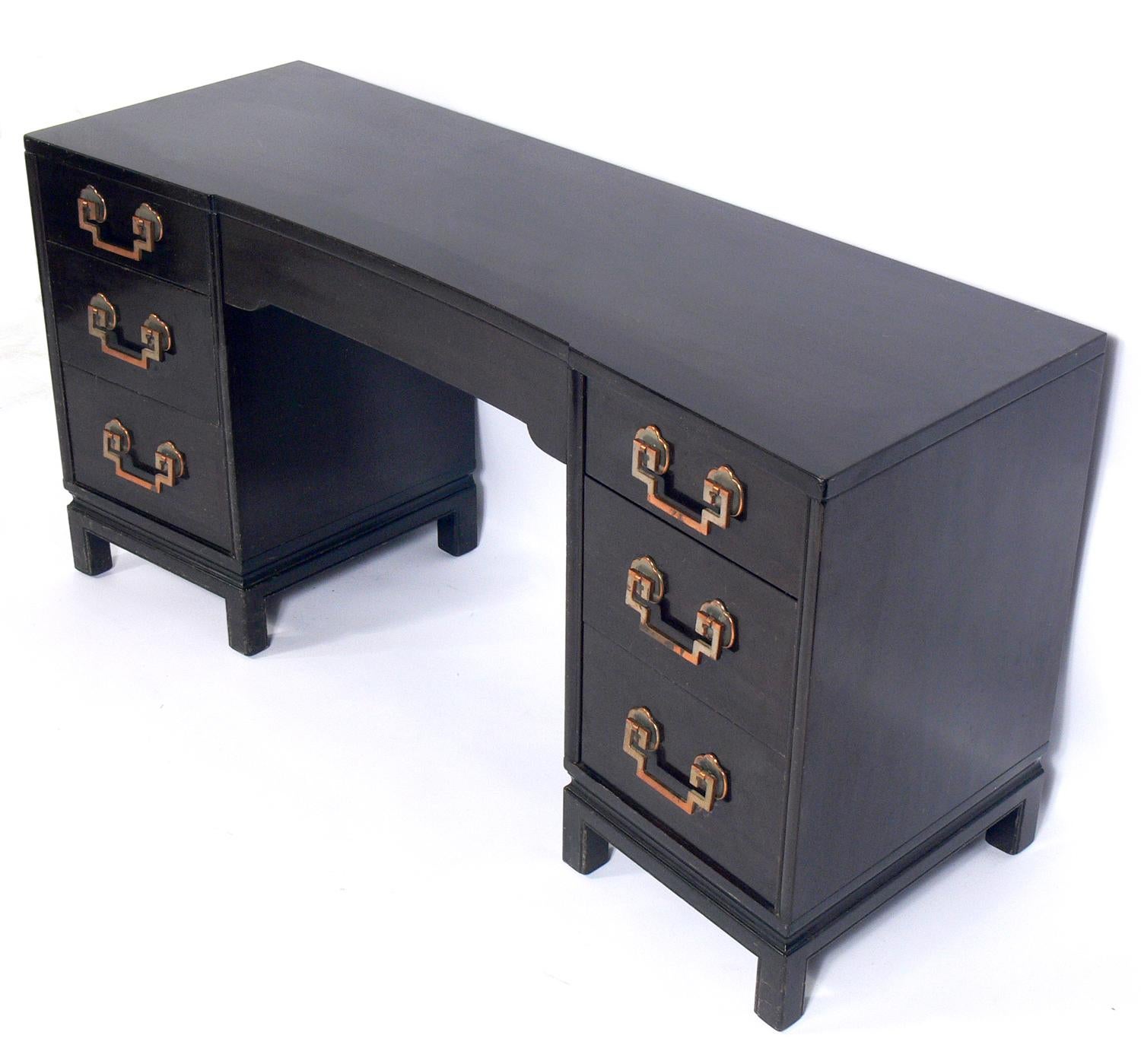 Asian influenced midcentury desk, American, circa 1950s. This desk is currently being refinished and can be completed in your choice of color. Would look wonderful refinished in it's original deep brown color, or in a solid color lacquer like black