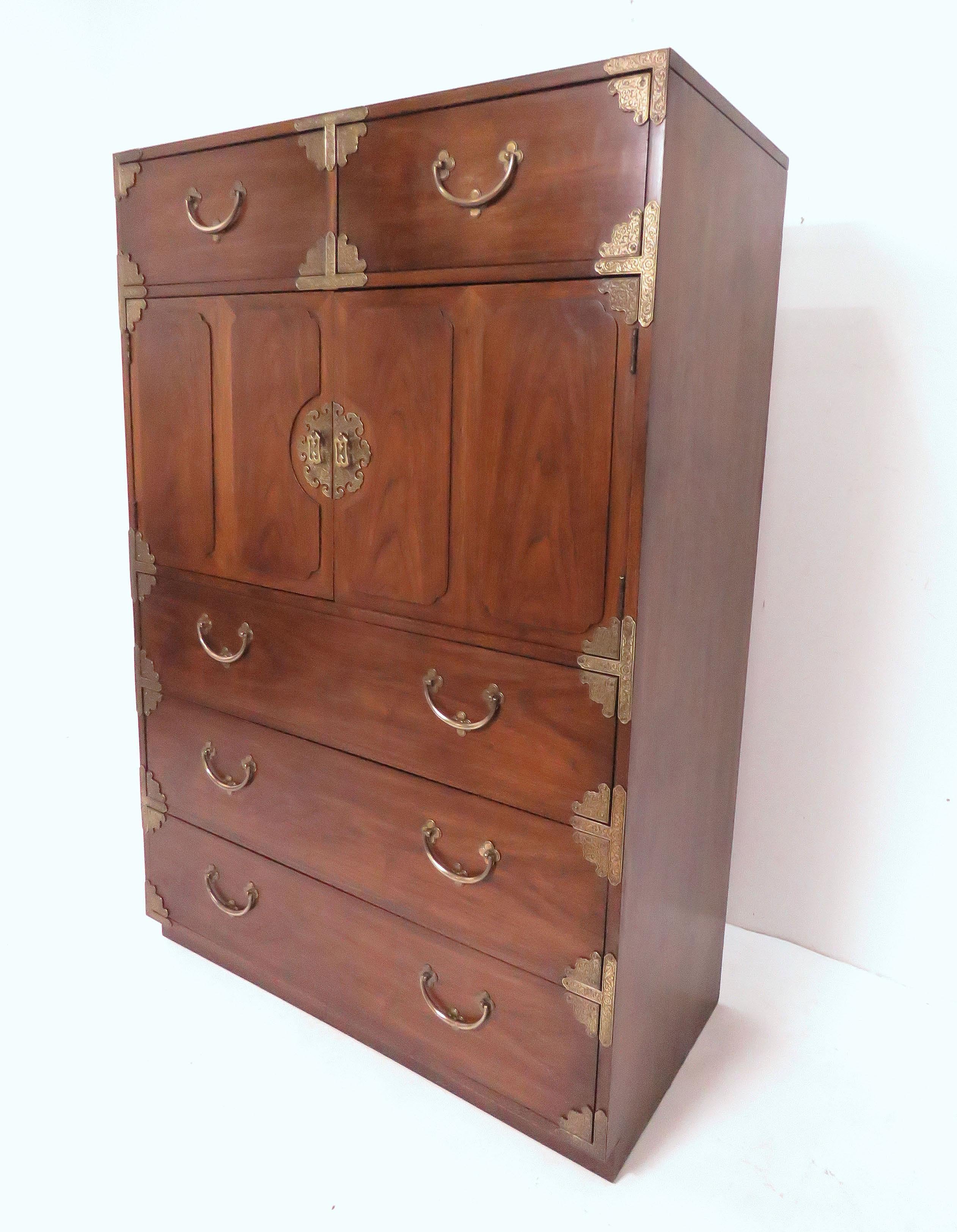 Highboy campaign chest in walnut by Thomasville, circa 1970s. This line, identical to the 