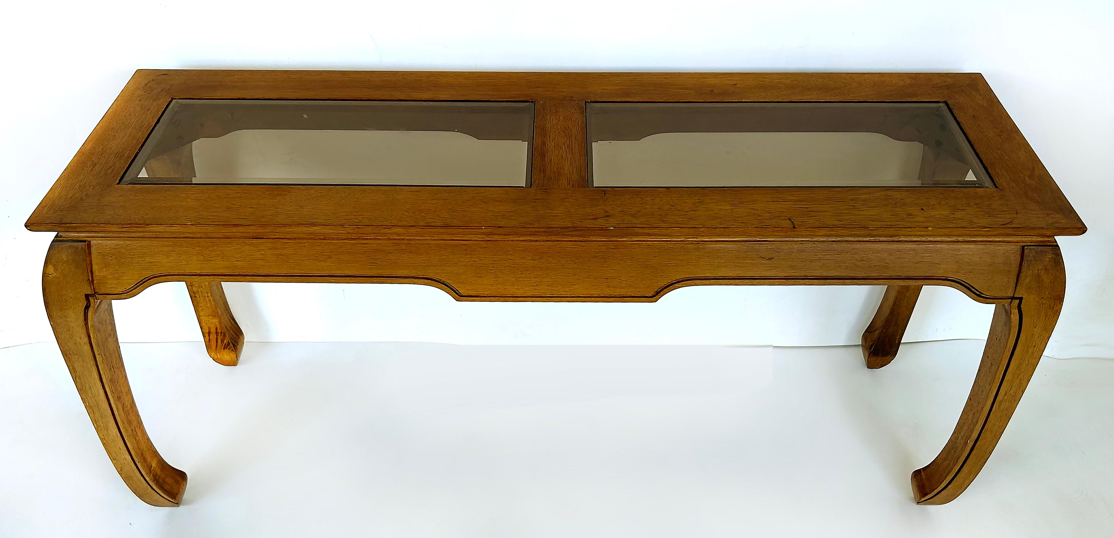 Asian Inspired Console Table, Beveled Glass Inset Tops, Late 20th Century

Offered for sale is an Asian inspired console table with two beveled inset glass tops. This console can also be used as a sofa table. The matching coffee/cocktail table is