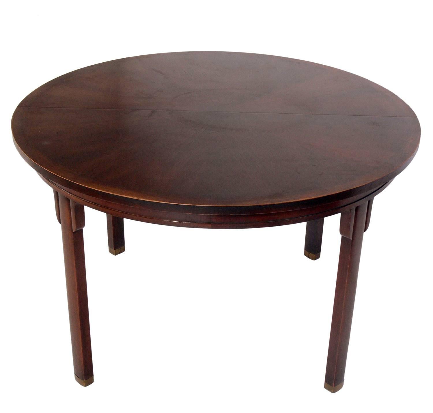 Asian inspired dining table by Michael Taylor for Baker, American, circa 1960s. This table expands from a compact 48