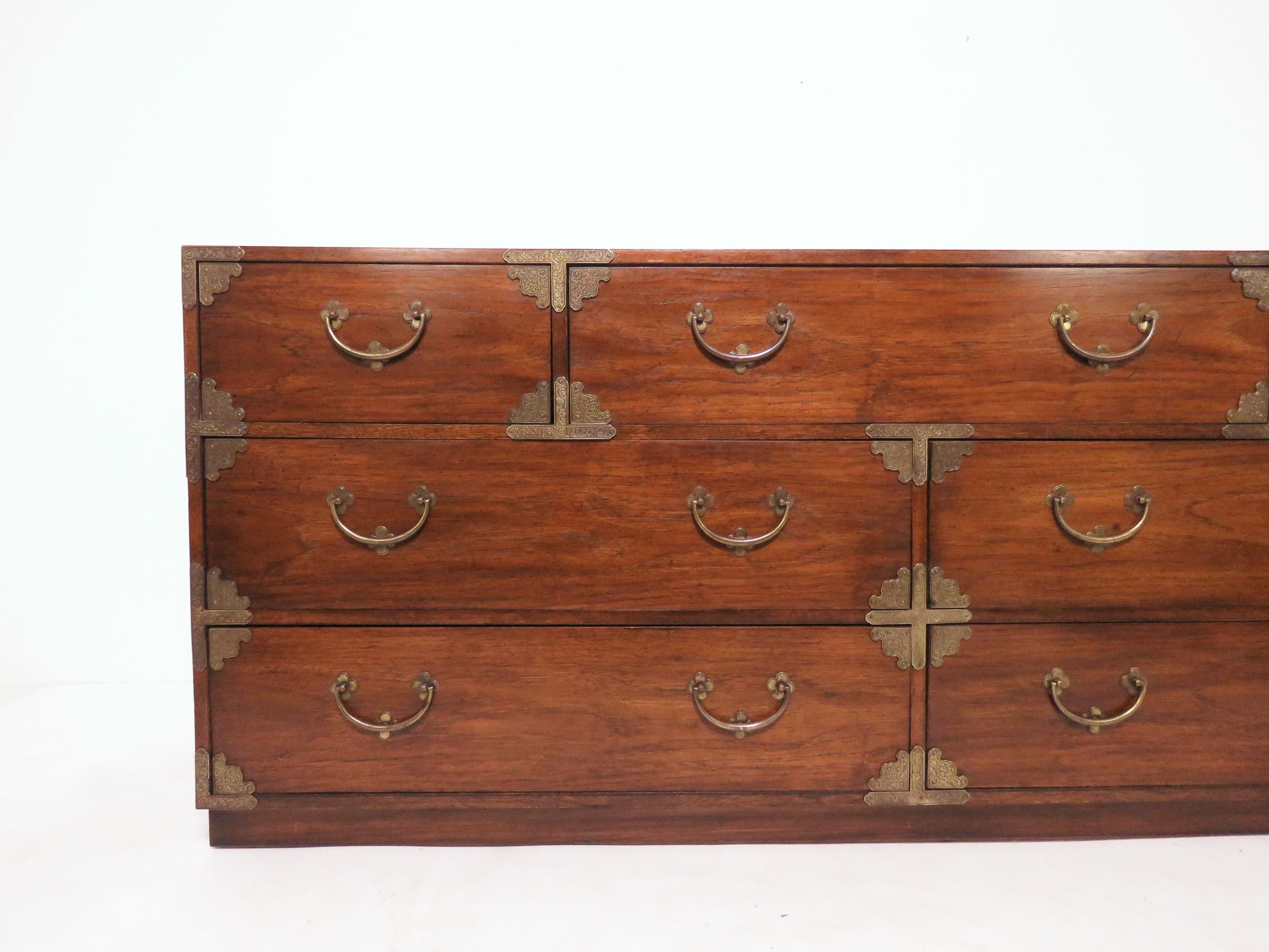 Long low chest of drawers in walnut by Thomasville, circa 1970s. This line, identical to the 