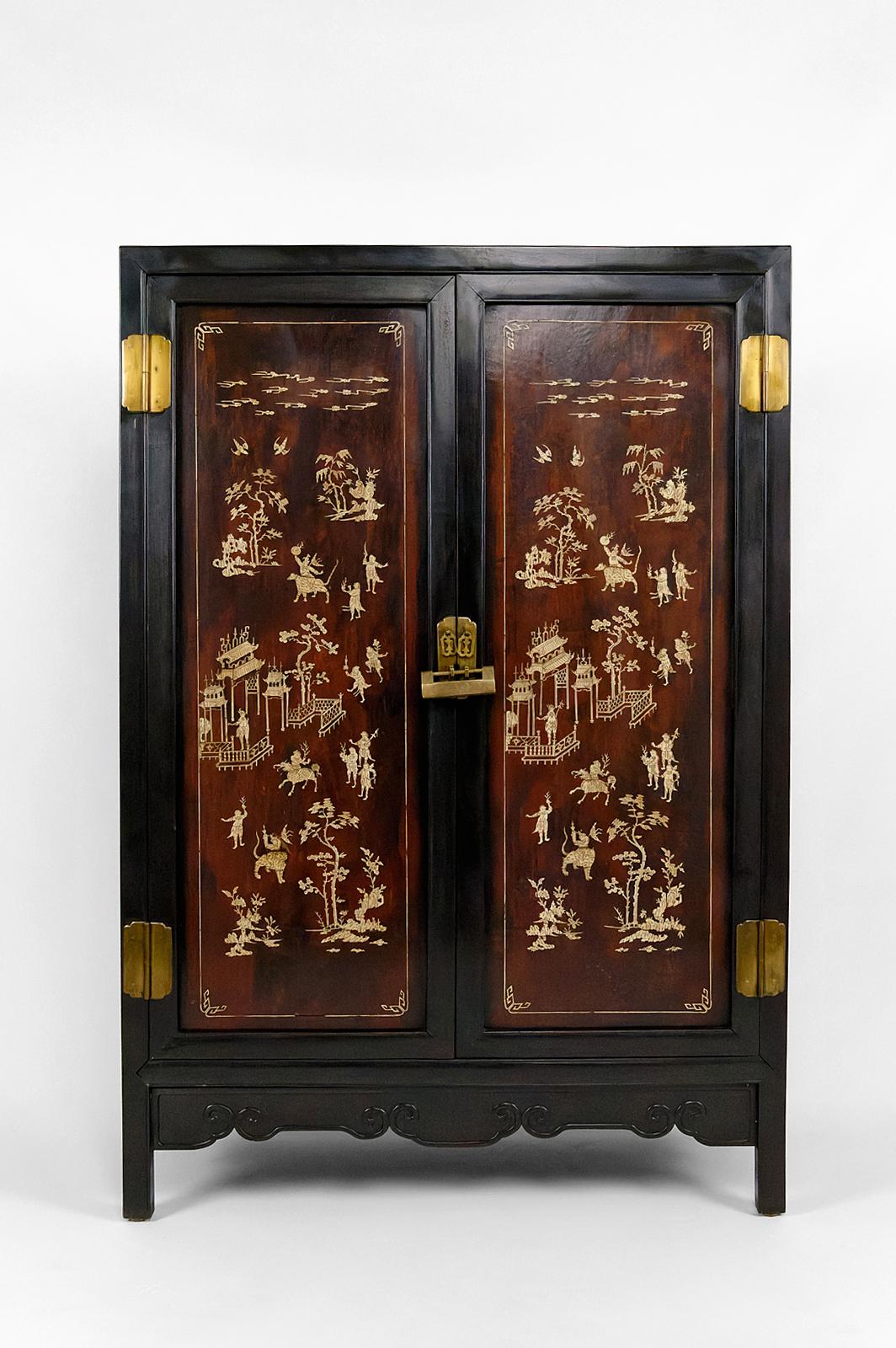 Indochina or south china.
Circa 1880-1900
Brass hinges, handles and padlocks
Double door cabinet with two shelves
Pretty marquetry: vegetation, birds, mythological creatures / deities riding tigers and kirins.
Good general condition, some gaps in