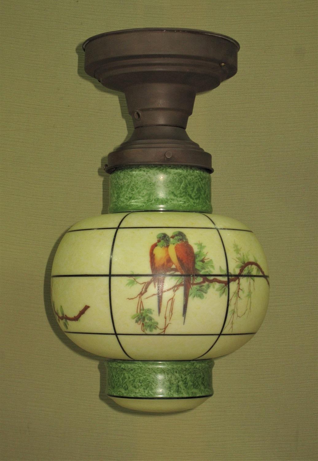 Very well designed vintage globe inspired by the paper lanterns of Japan and China, among others. A rare pattern which we seldom see.
Three panels of hand stenciled Parrots surround the globe with two designs repeating. 