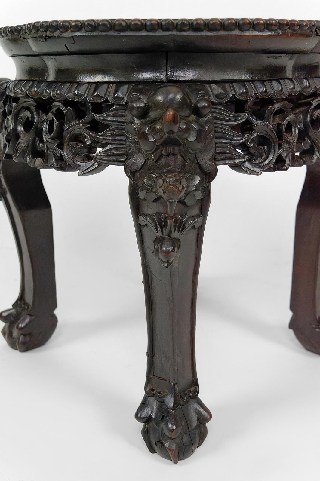 Wood Asian low stand / side table in wood carved with Demons, marble top, 1880's  For Sale