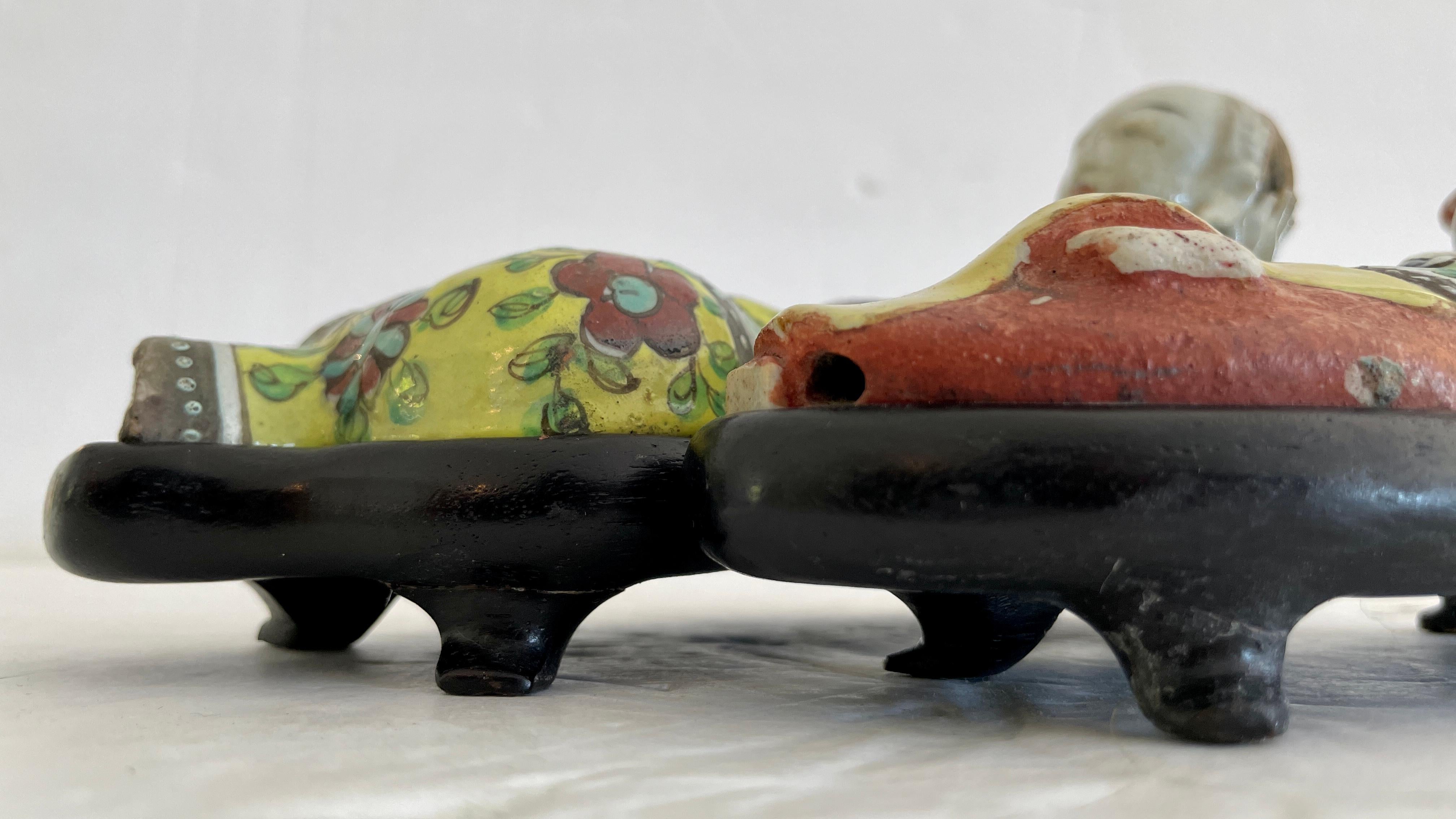 Pair of antique Asian male and female figurines laying on their beds. Nice ceramic with beautiful colors. Add them to your Asian inspired interiors and table tops.