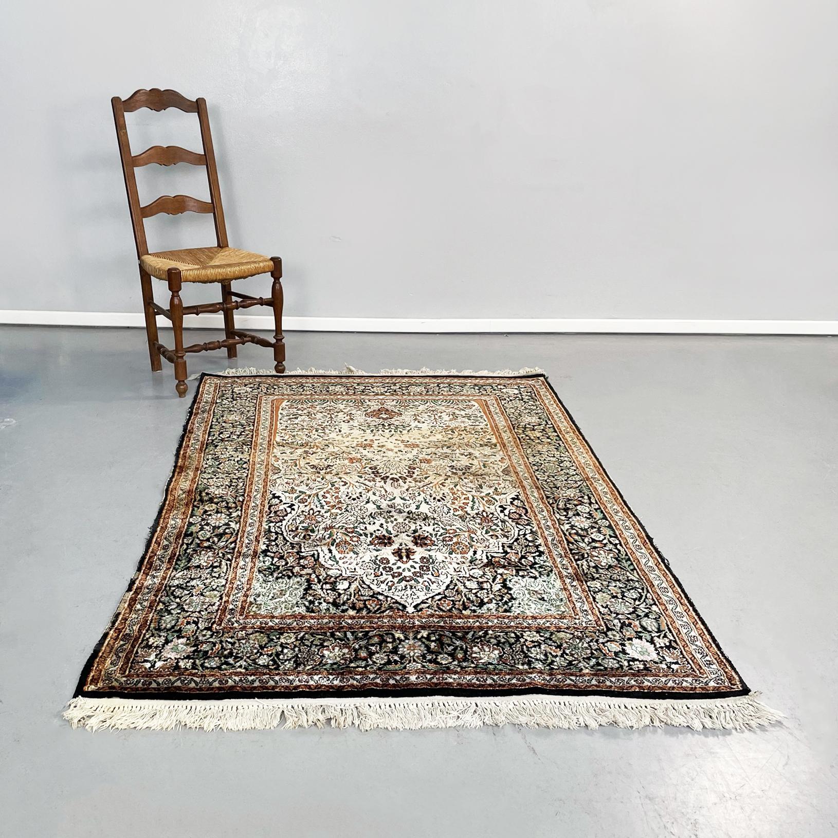 Mid-Century Modern Persian carpet in beige red black fabric, 1950s
Rectangular persian carpet in light colored fabric with floral pattern, typical of these rugs. Black exterior profile and red and beige interior. At two ends it has white