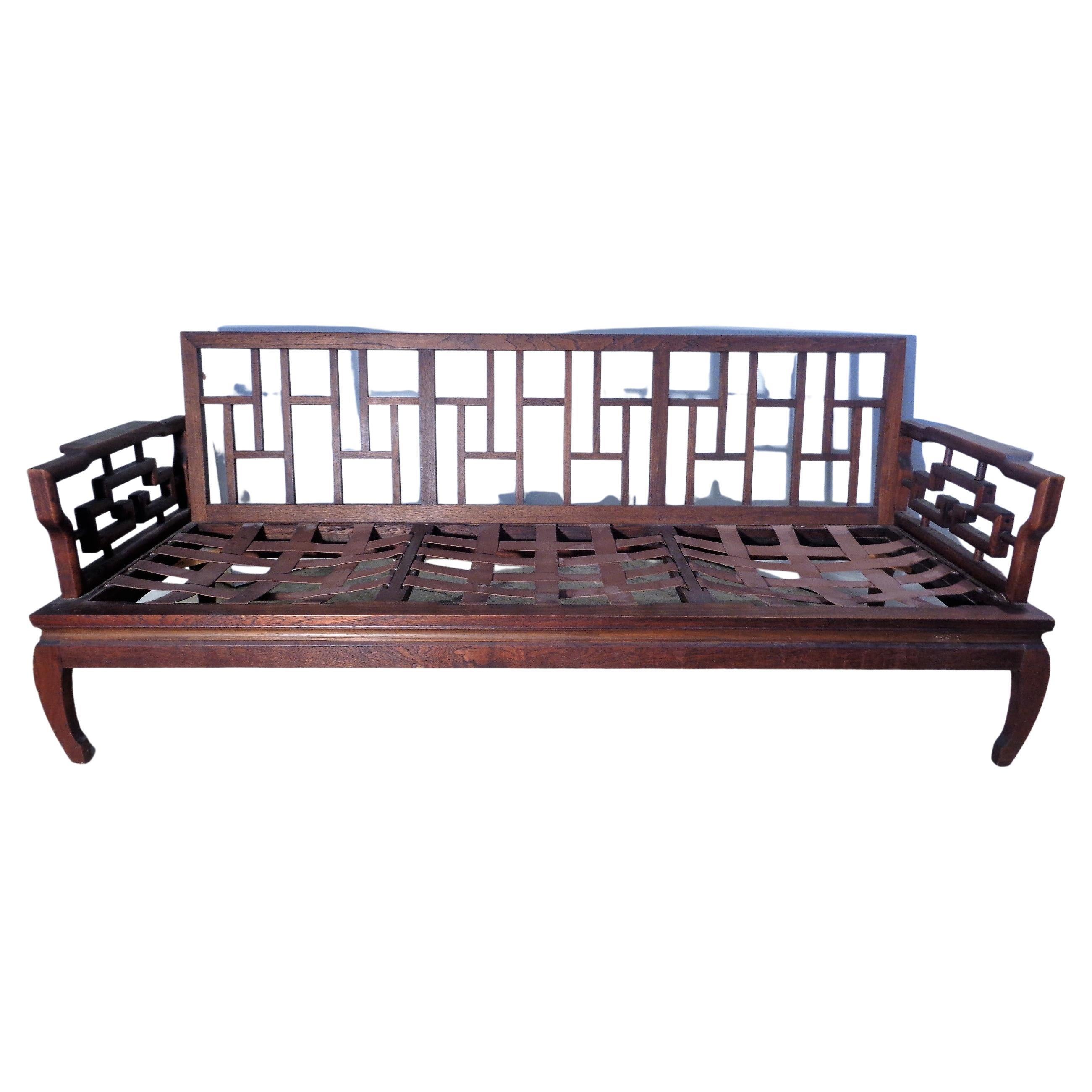 Very elegant Ming style mahogany  hardwood sofa settee in nicely aged original color w/ beautifully figured grain to wood. Fine hand crafted hand carved details and pegged woodwork construction. Purchased by a missionary living in Singapore and