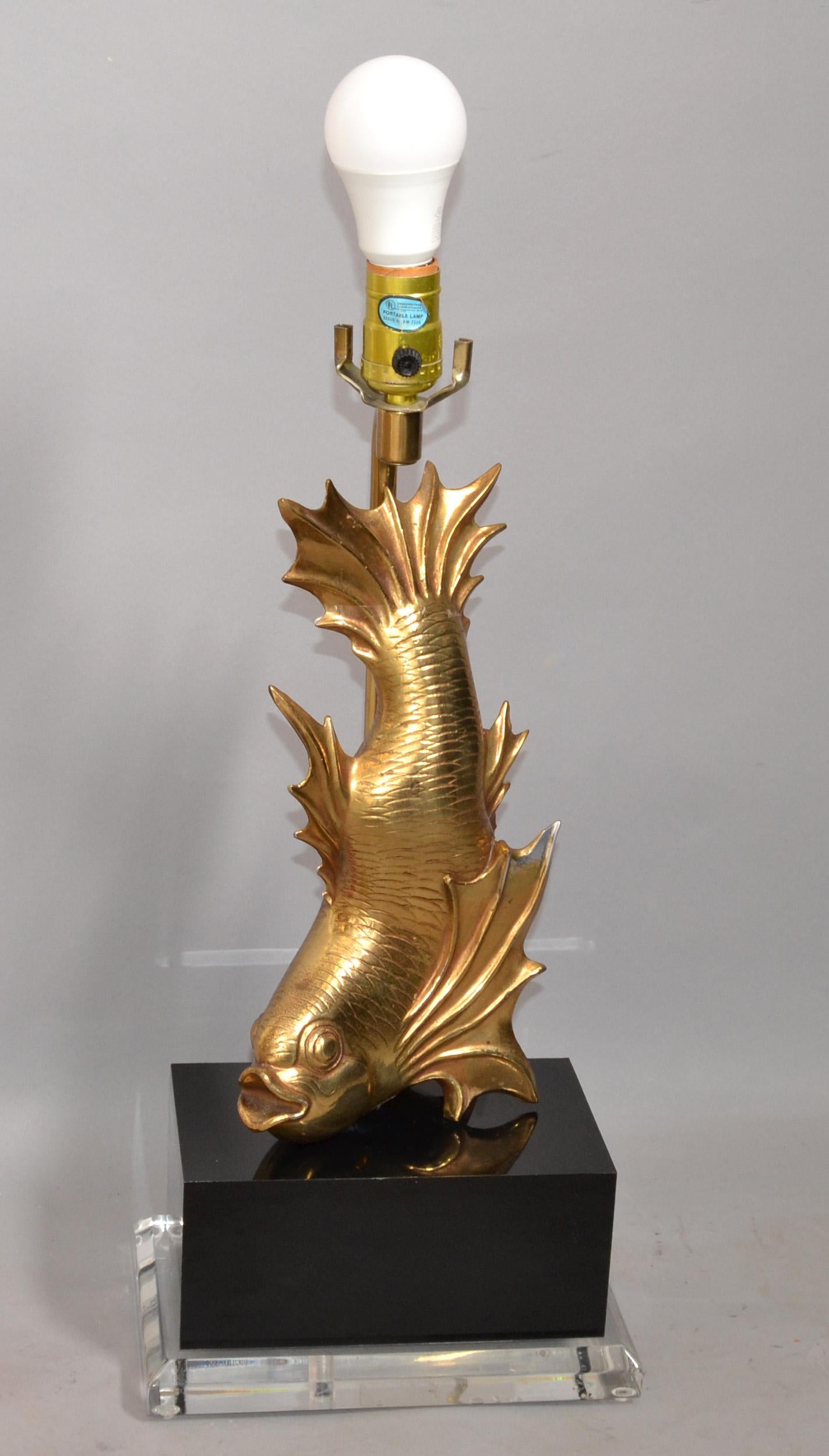 Stylized Japanese Dragon Cast Brass Koi Fish Table Lamp mounted on a transparent beveled Lucite Base and rectangle black acrylic block.
The Lamp is in perfect working condition, wired for the US, UL-Listed and takes a regular or LED Light Bulb.
No