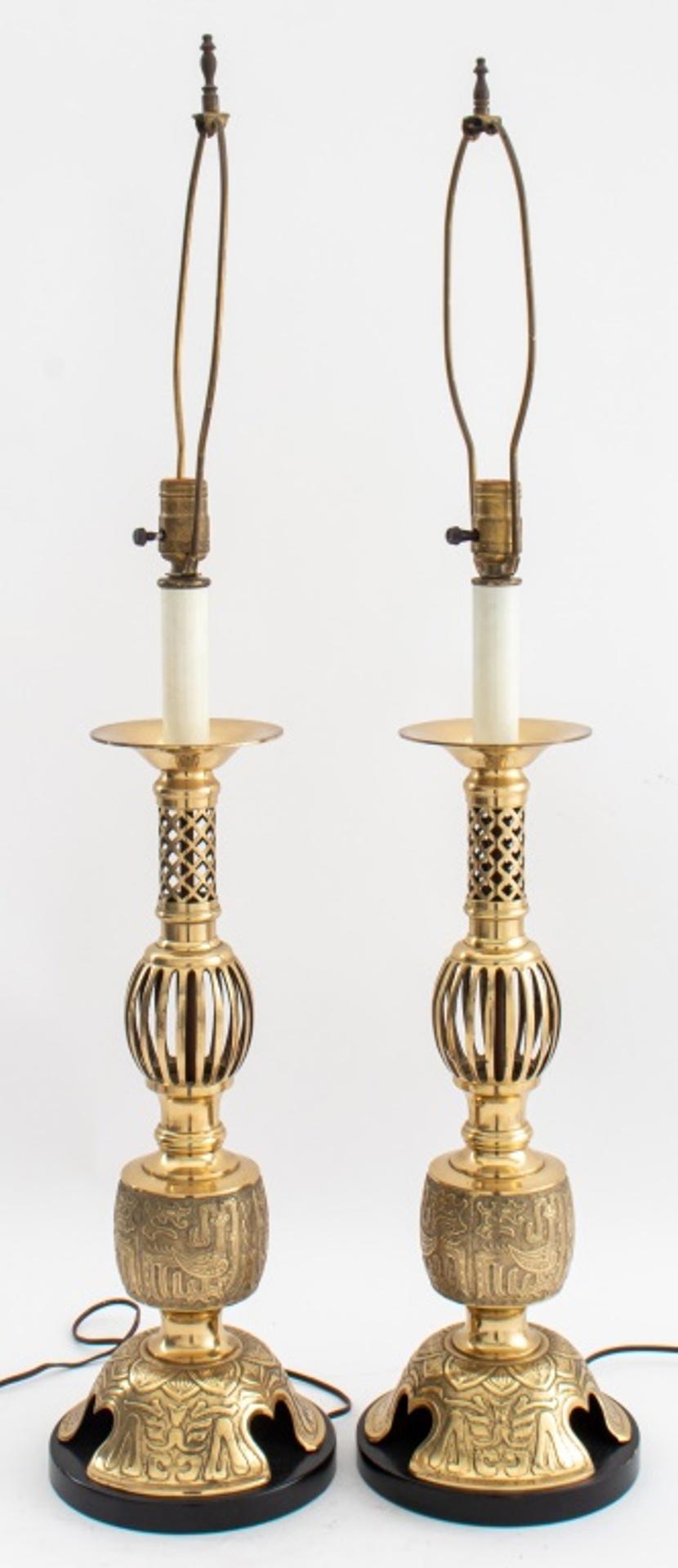Asian modern style table lamps, pair, c. 1970s, in the form of candle pricket sticks, with openwork sides and heavily debossed base with Shang Dynasty-inspired symbols on tripartite circular base. 39