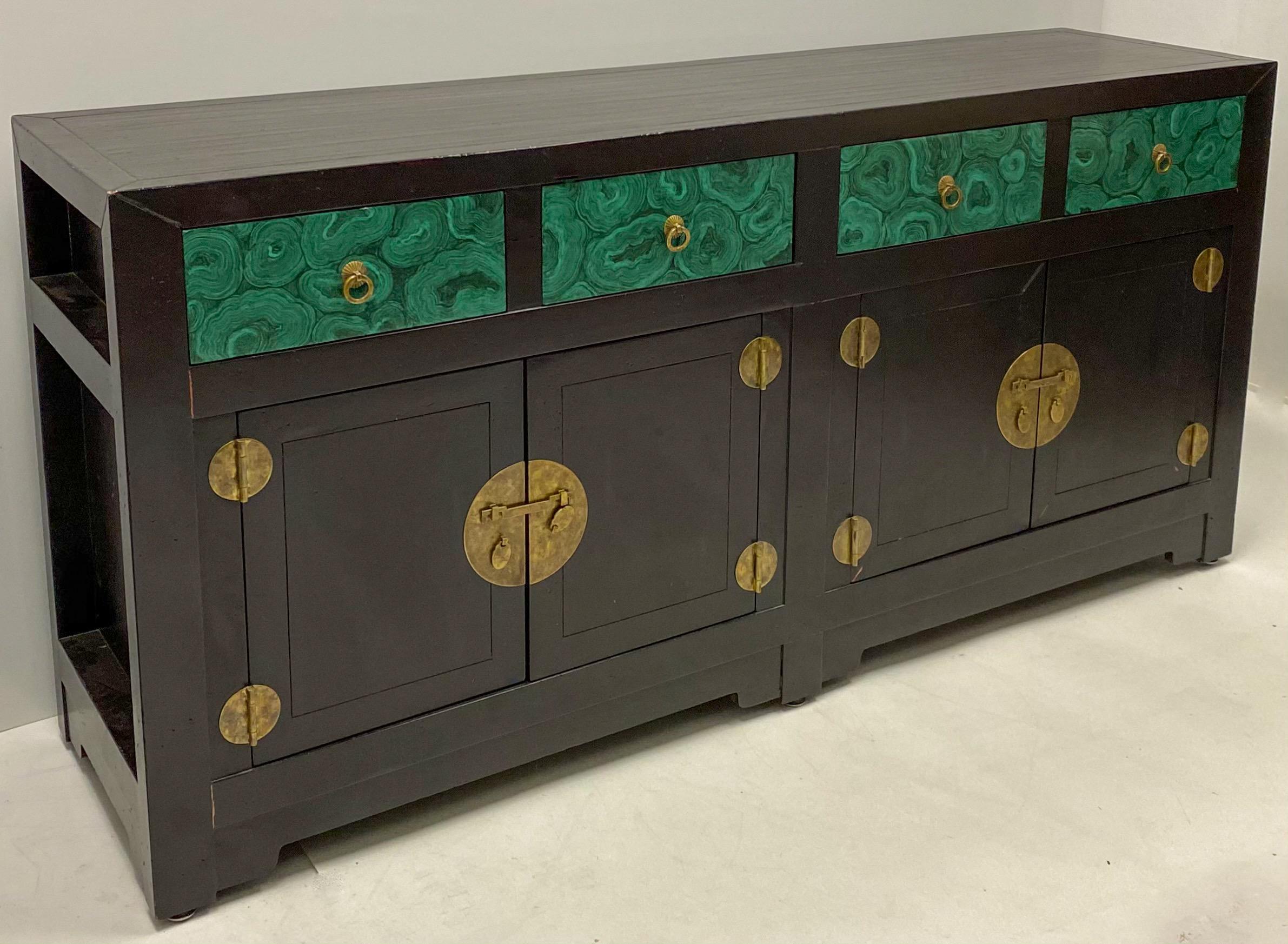 This is a large Asian style credenza by Henredon. It makes a bold decorating statement with it’s hand painted faux malachite drawer fronts. It is marked and in very good condition.