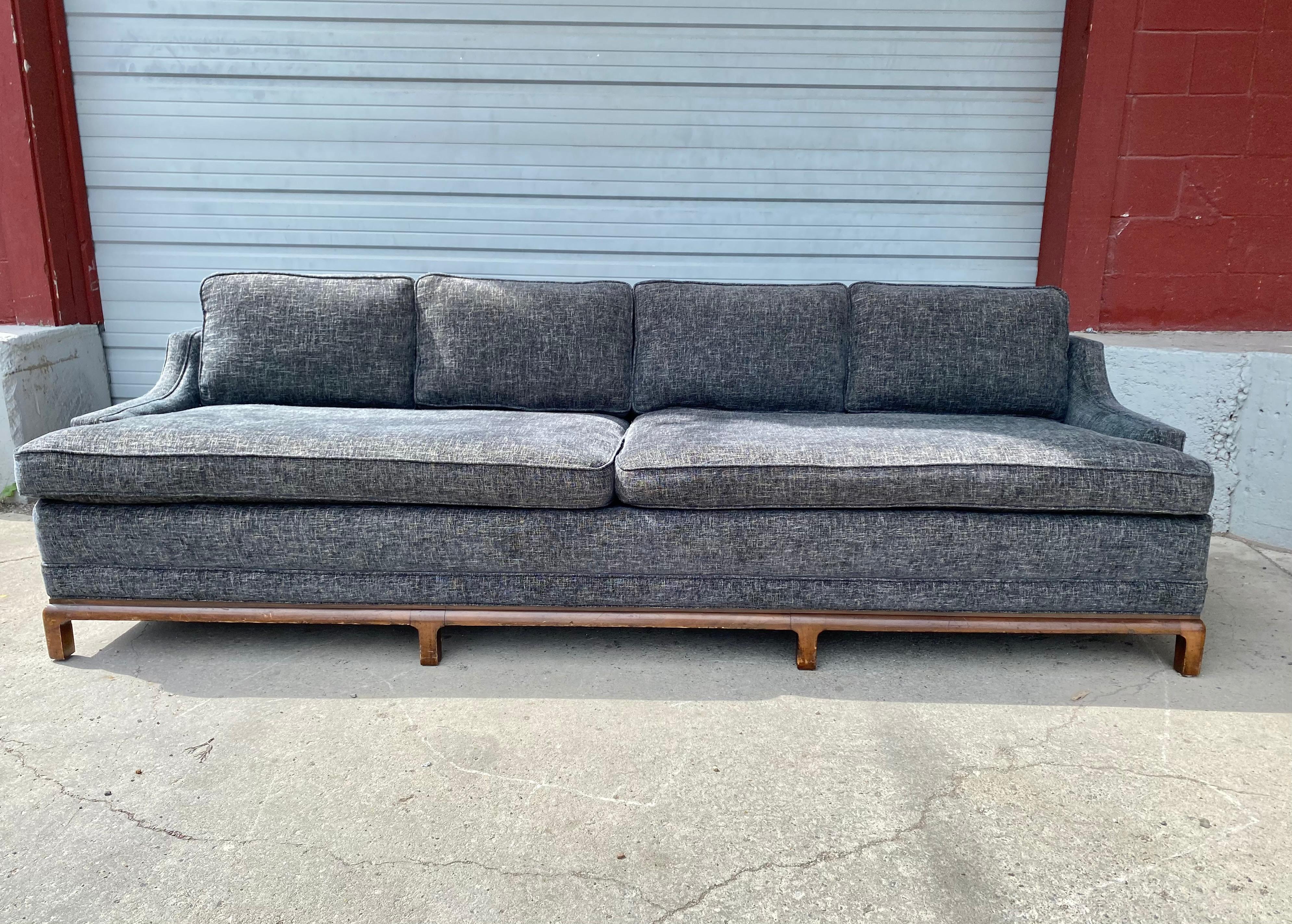 Asian modernist sofa attributed to T. H. Robsjohn-Gibbings for Widdicomb, recently re-upholstered. wonderful grey/ blue wool fabric. Extremely comfortable, superior quality and construction, great modernist design, solid wood Asian Style base, Hand