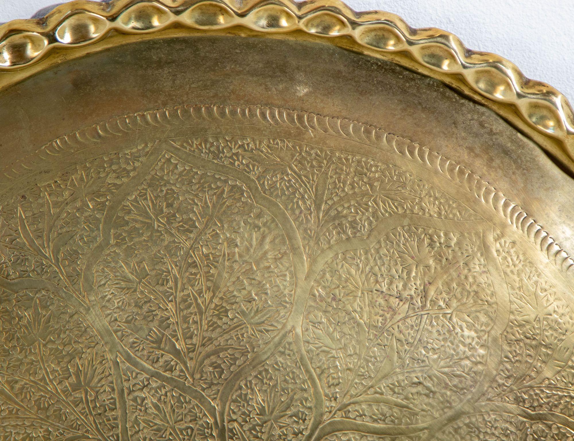 Asian Mughal Rajasthani Large Polished Round Brass Tray with Crest Edges.
Asian Antique Mughal Rajasthani Large Polished round Brass Tray with crest edges, 3o inches in diameter.
Rare find, large antique brass tray 30 inches diameter finely engraved