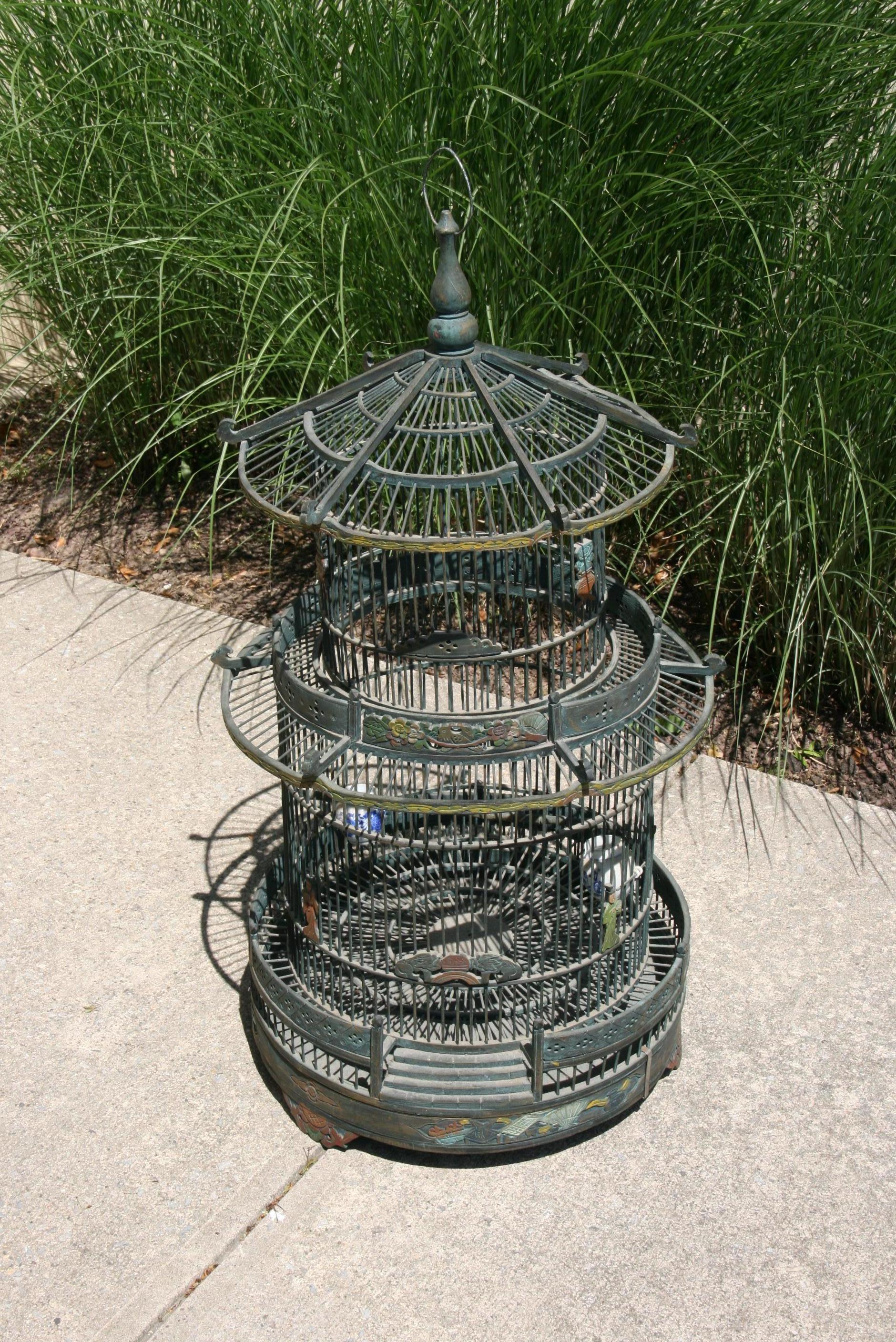 3-577 Pagoda shaped bird cage with hand carved and painted detailing.