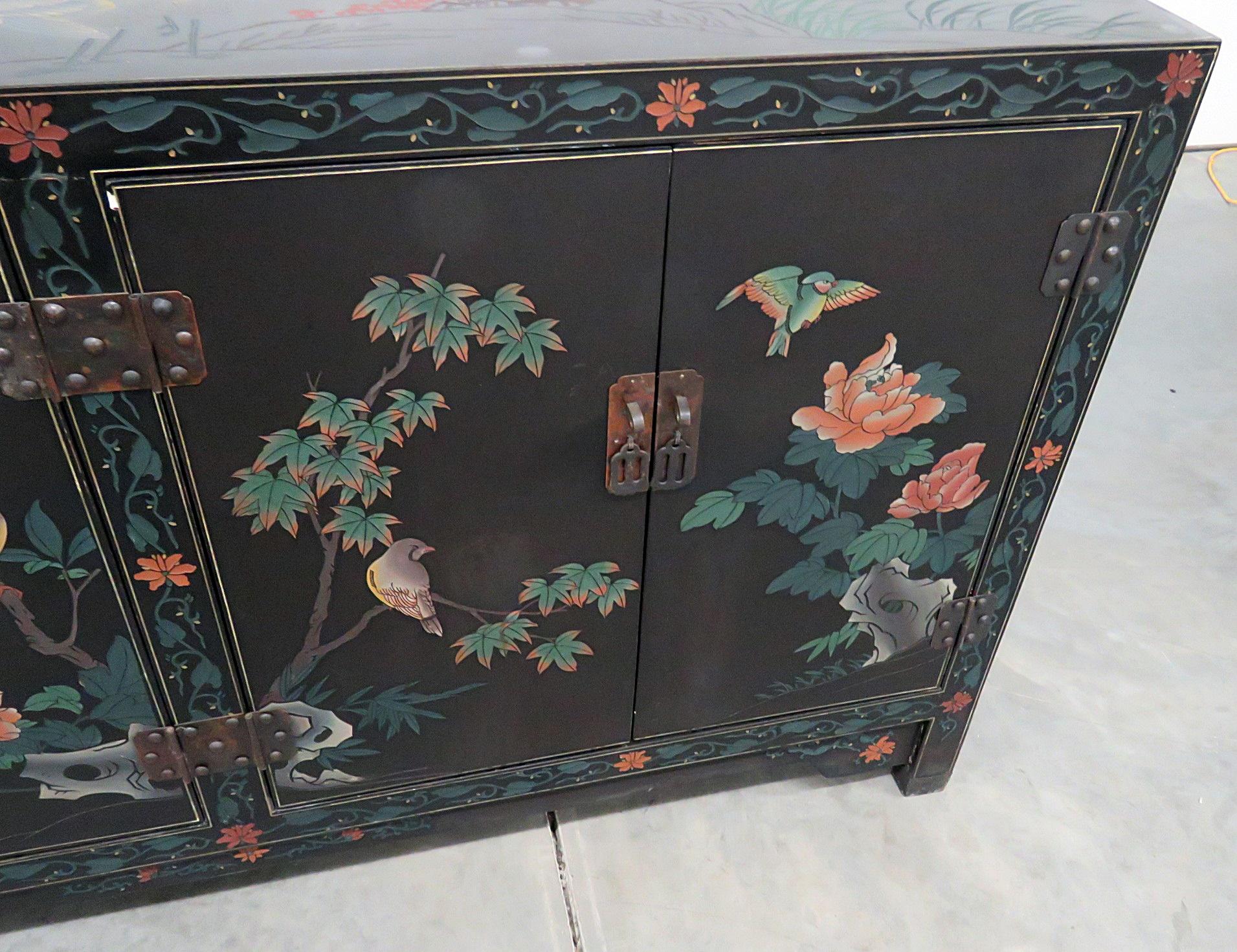 Asian paint decorated cabinet with 4 doors and 2 shelves.