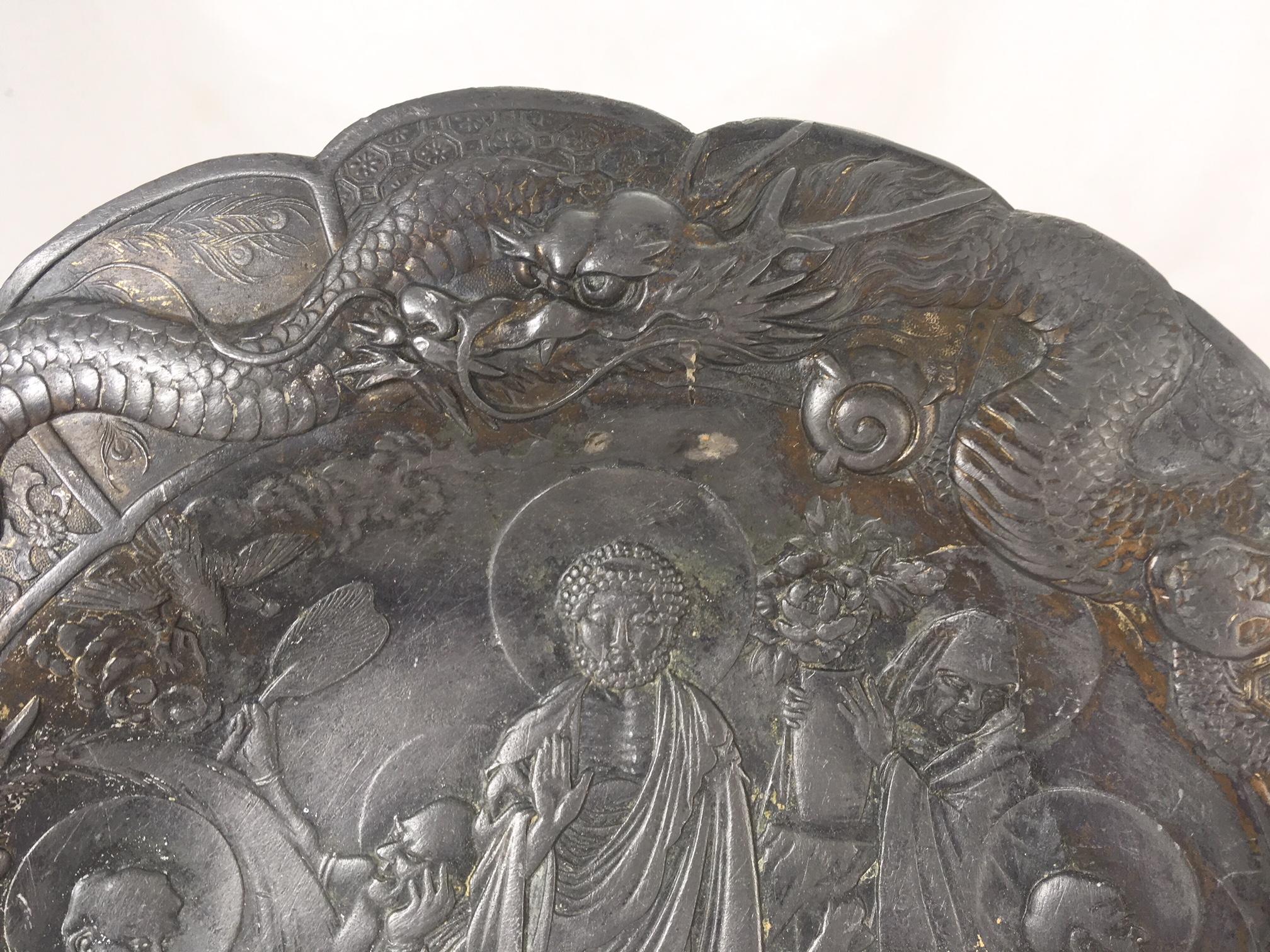 Asian Pewter plate with Boddhisatva in the garden, 19th century.