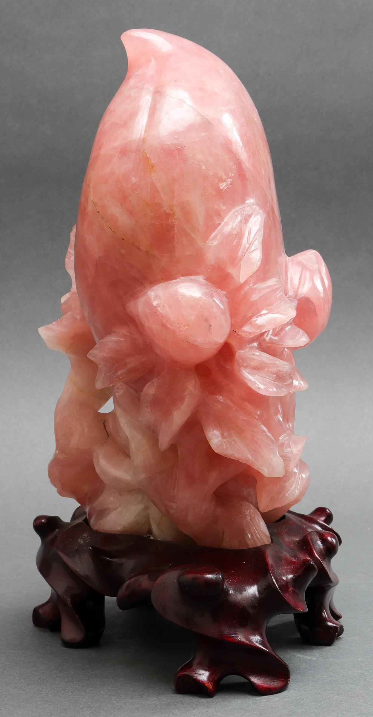 Pair of carved rose quartz sculptures depicting peaches,, a motive that symbolizes longevity, on biomorphic carved wood stands. 11