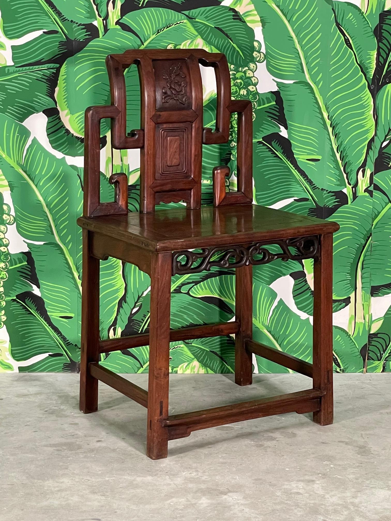 Early 19th century Asian scribe's chair features hand carved skirt and back detailing, and mortised joints. Rare example of artisan craftsmanship that has been well preserved. Good condition with imperfections consistent with age (see photos). 
For