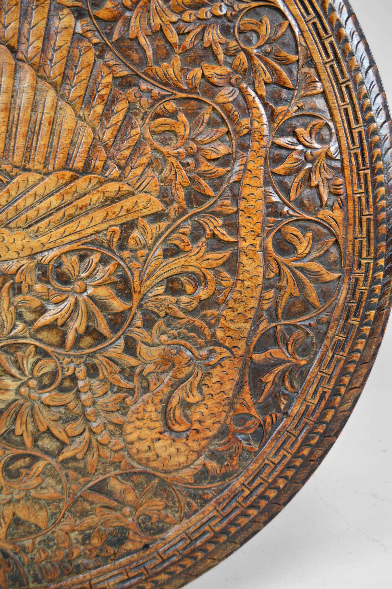 Asian Round Coffee Table Carved with Dragons and Peacocks, Indonesia, circa 1920 For Sale 4
