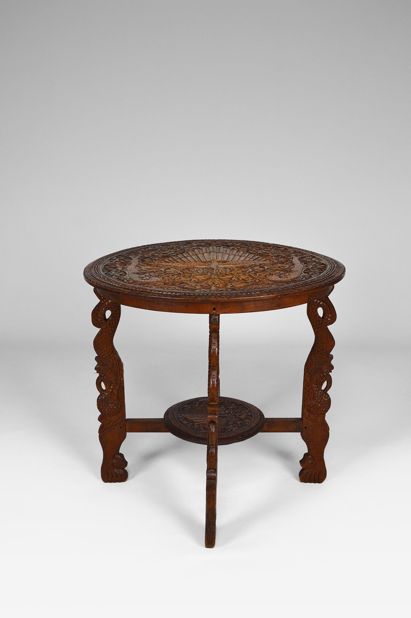 Chinese Export Asian Round Coffee Table Carved with Dragons and Peacocks, Indonesia, circa 1920 For Sale