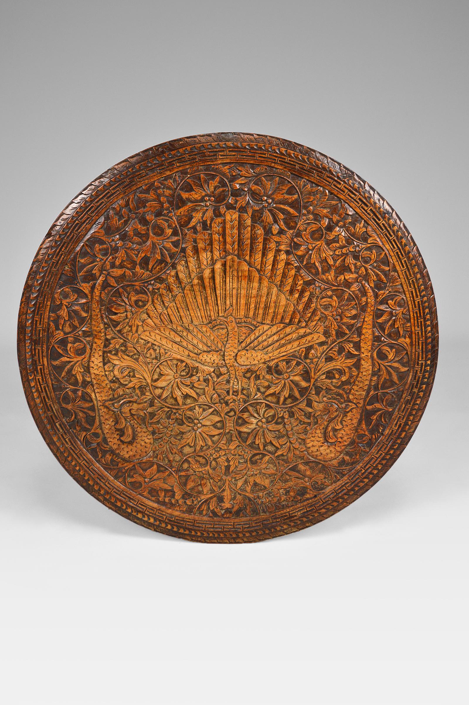 Wood Asian Round Coffee Table Carved with Dragons and Peacocks, Indonesia, circa 1920 For Sale