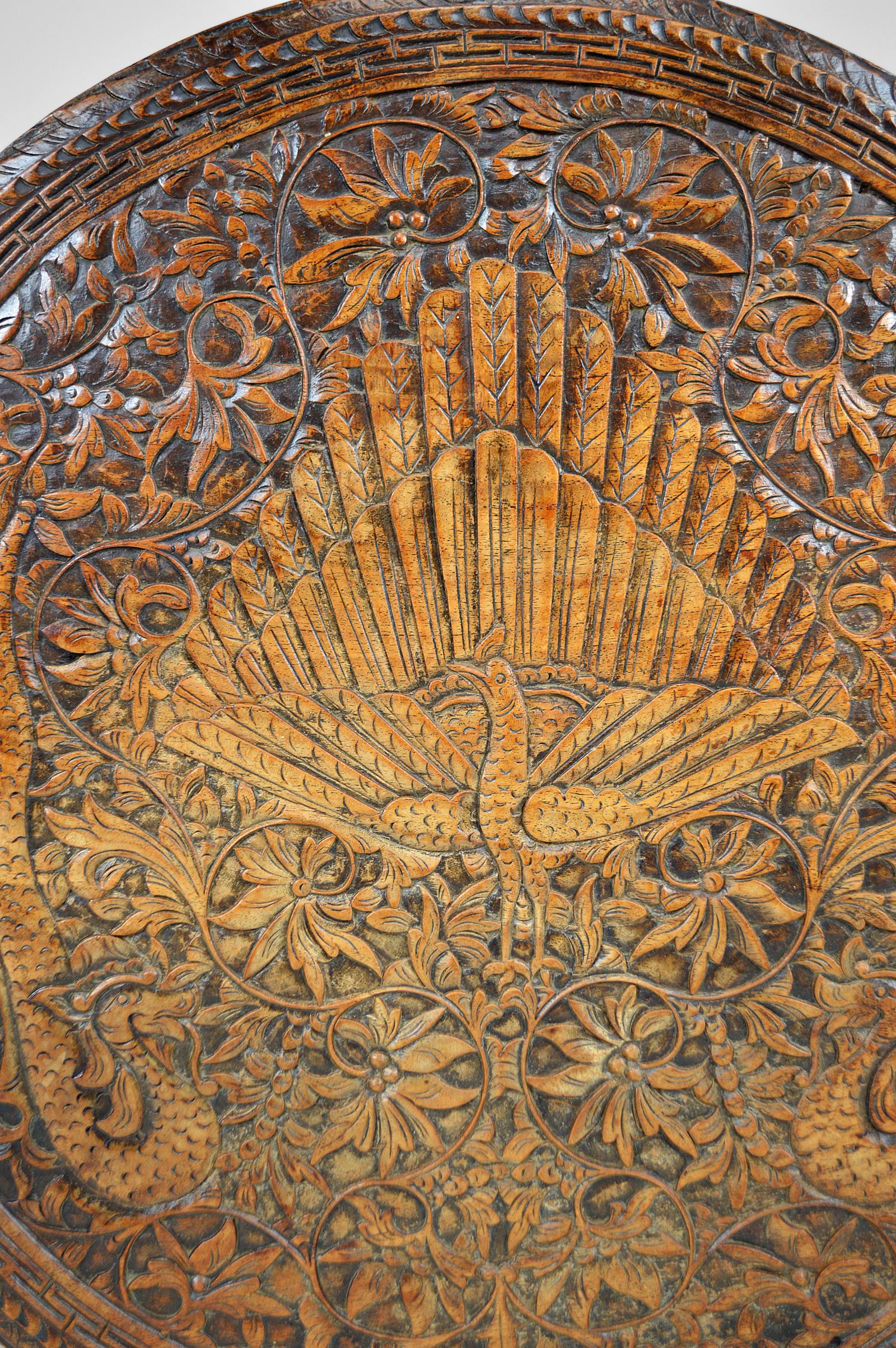 Asian Round Coffee Table Carved with Dragons and Peacocks, Indonesia, circa 1920 For Sale 1