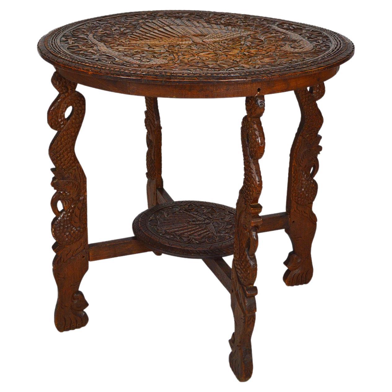 Asian Round Coffee Table Carved with Dragons and Peacocks, Indonesia, circa 1920 For Sale