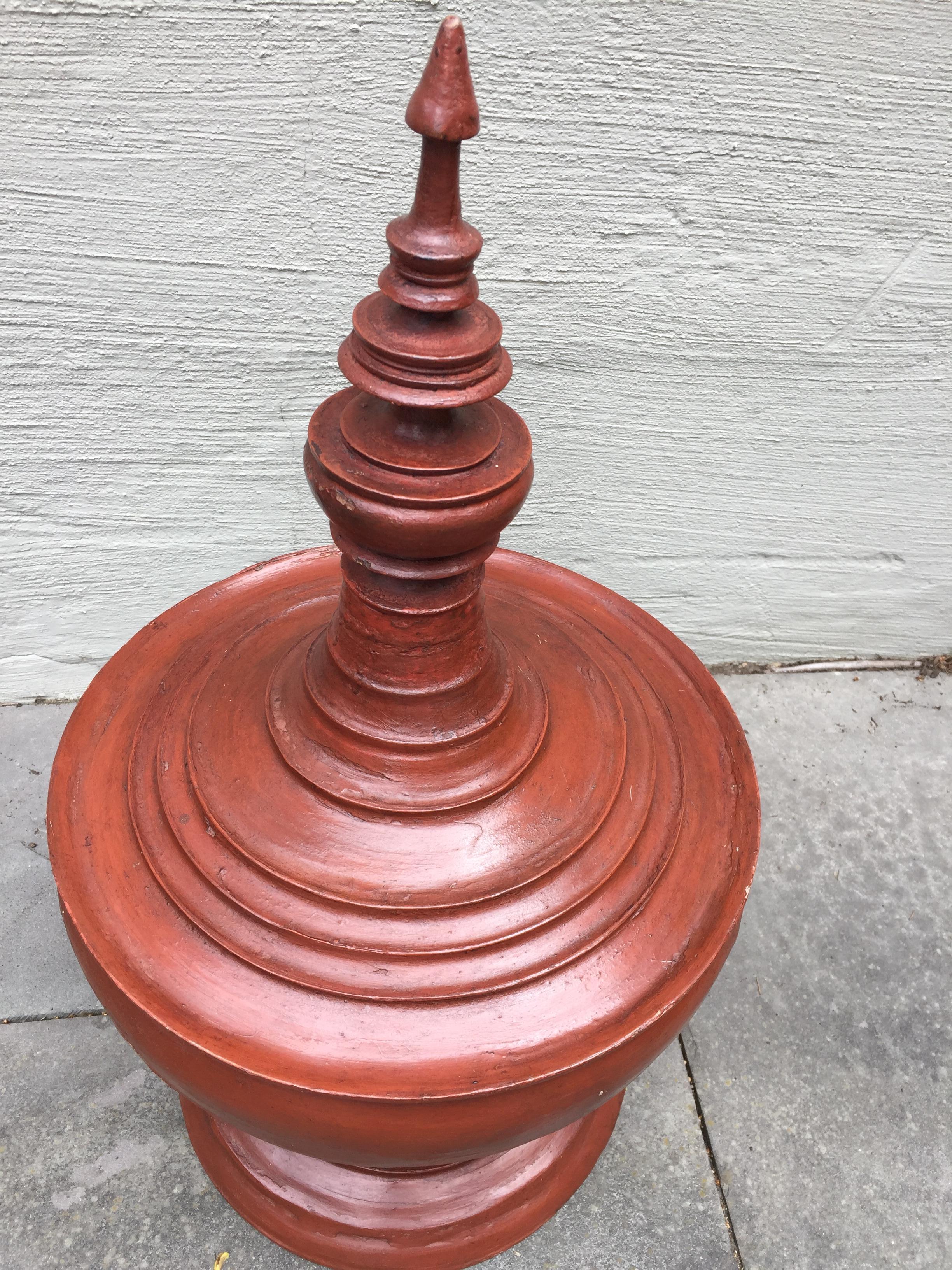 Asian vintage architectural piece
this elegant urn collected on an Asian holiday in 1960s . This wooden offering urn looks like solid terra cotta, but is actually wood, two pieces, and very light. Boasts a gorgeous color,
incredible form, and is