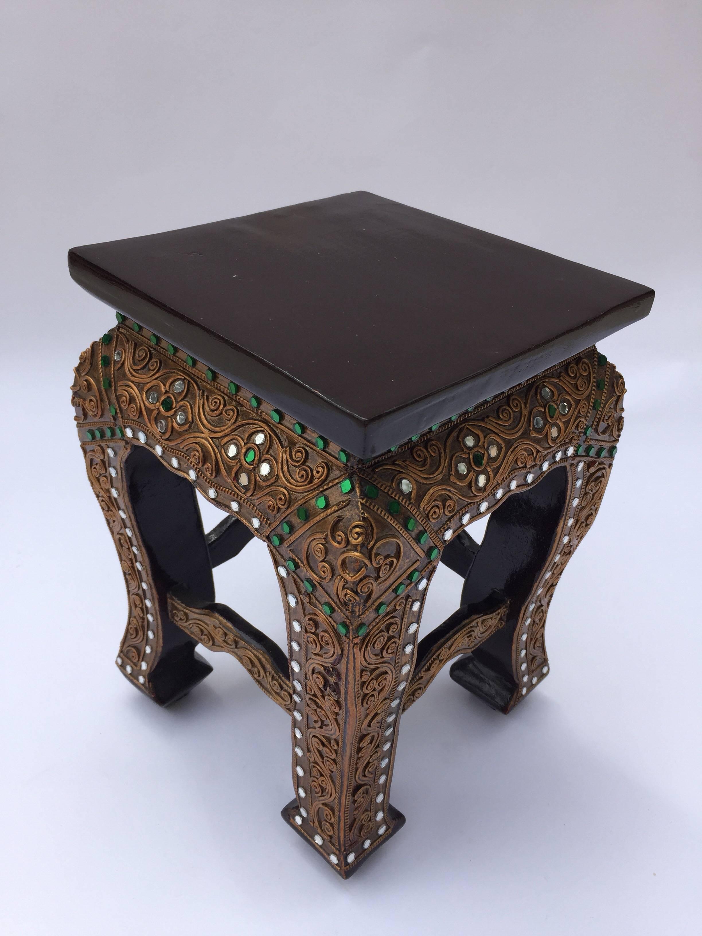 South East Asian brown lacquered wood gilded temple square low table stand.
Burmese, Myanmar stand with curved legs decorated with green and clear glass mirrors overlaid.
Uses in temples as stand for deities statues or offering bowls.
Probably from