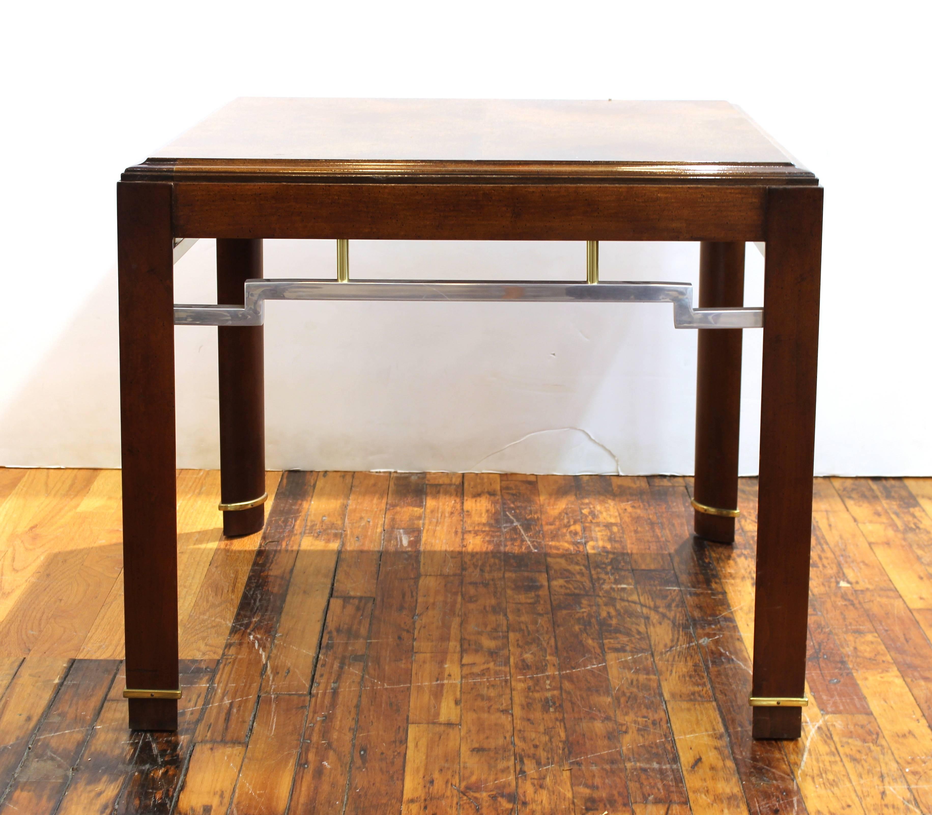 Asian inspired centre table or side table with wooden top and structure with metal embellishments. The piece has some scratches to the legs and dents to the top.