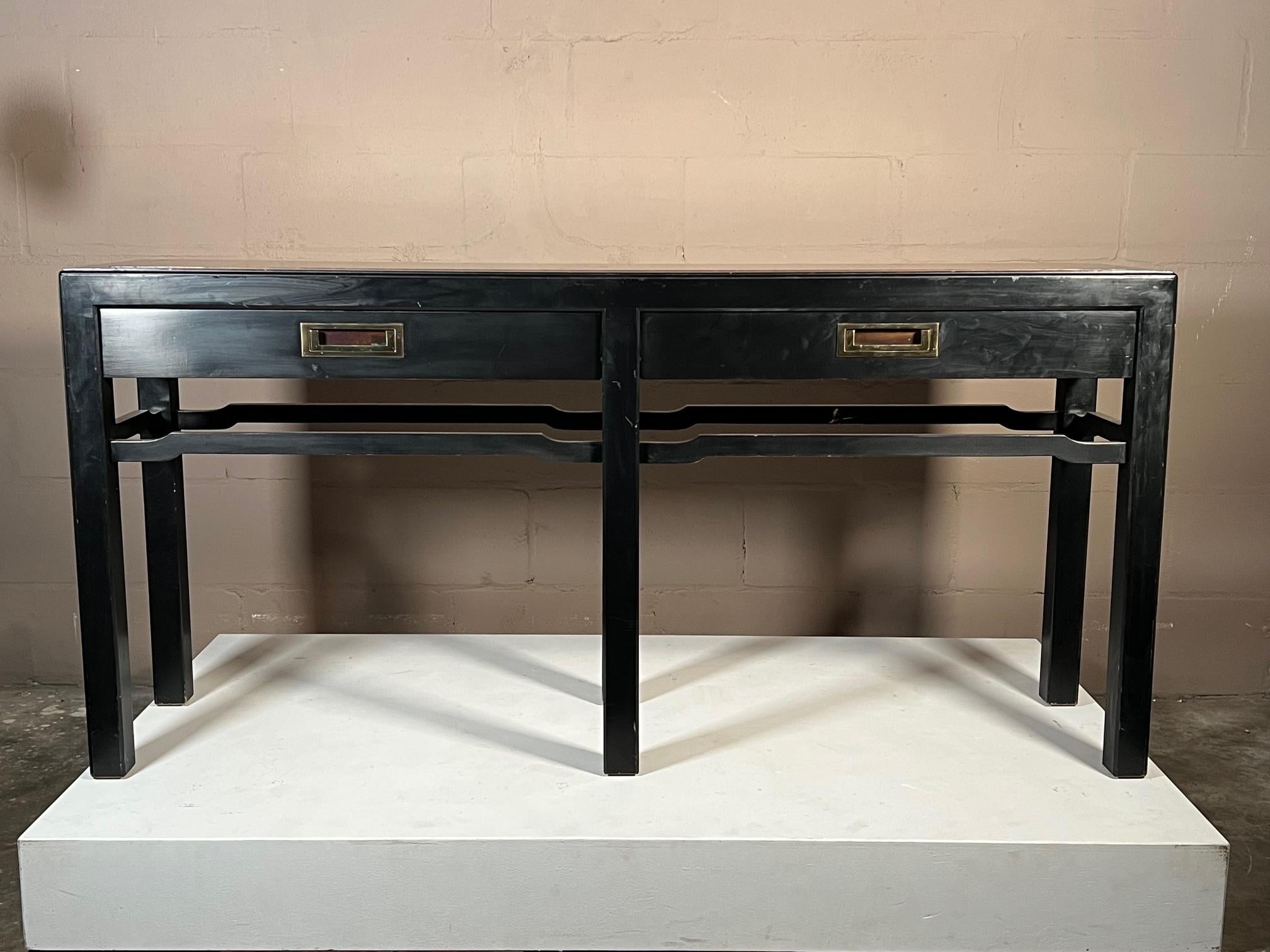 Unusual Asian style console table, with two drawers. Featuring solid brass hardware, burl wood top. Finished back.