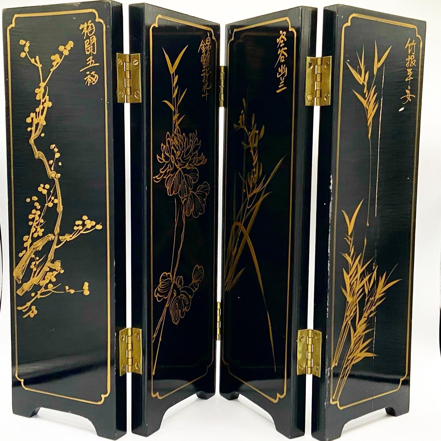 Unique Asian mini divider depicting beautiful birds and plant life. The reverse of each panel is also decorated with Asian paint depictions.

Additional information: 
Material: Wood
Color: Black
Style: Chinoiserie
Time period: early 20th