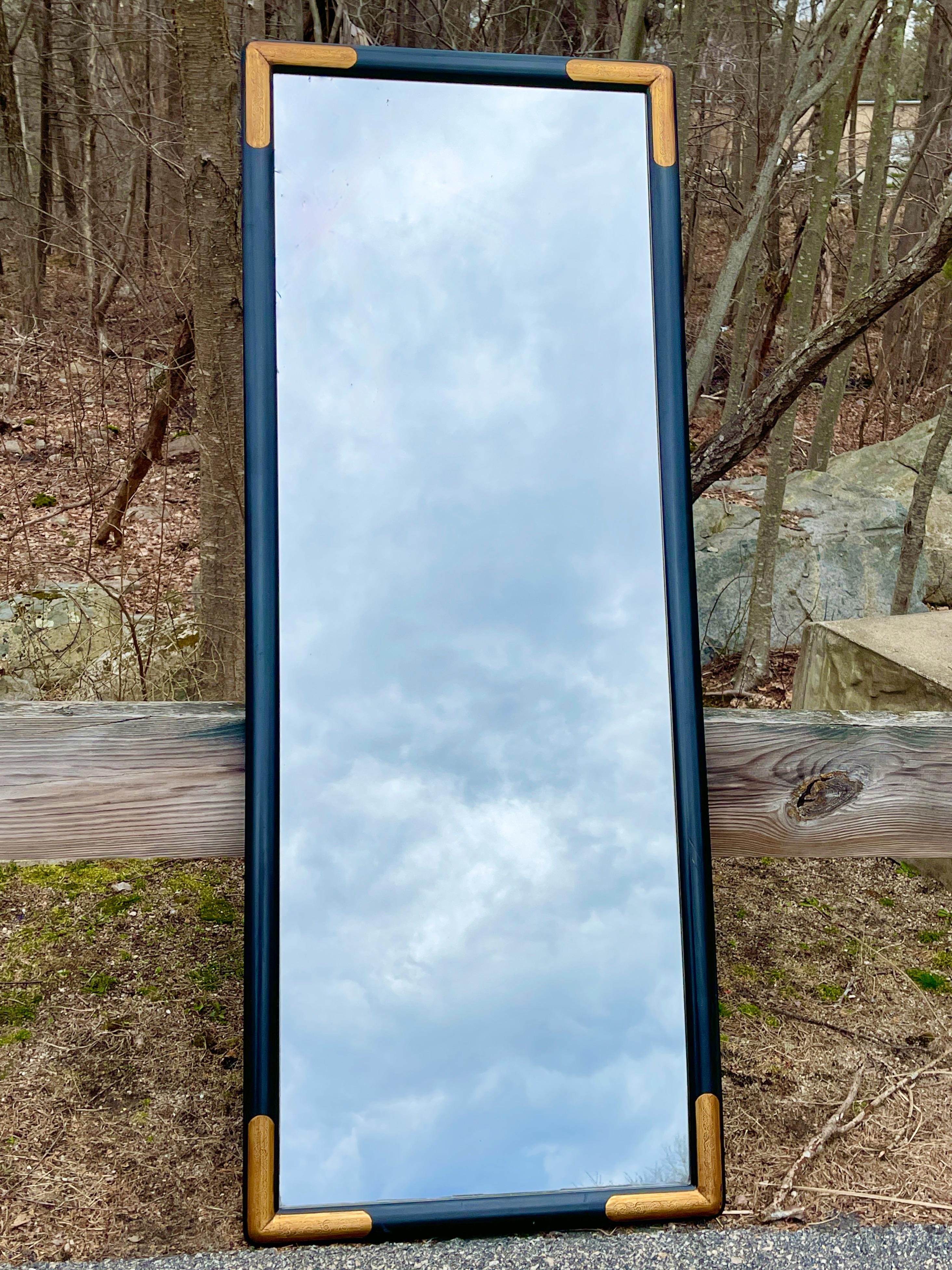 Asian style full length mirror in ebonized wood frame with gilt accents in four corners. 
Measures: 72